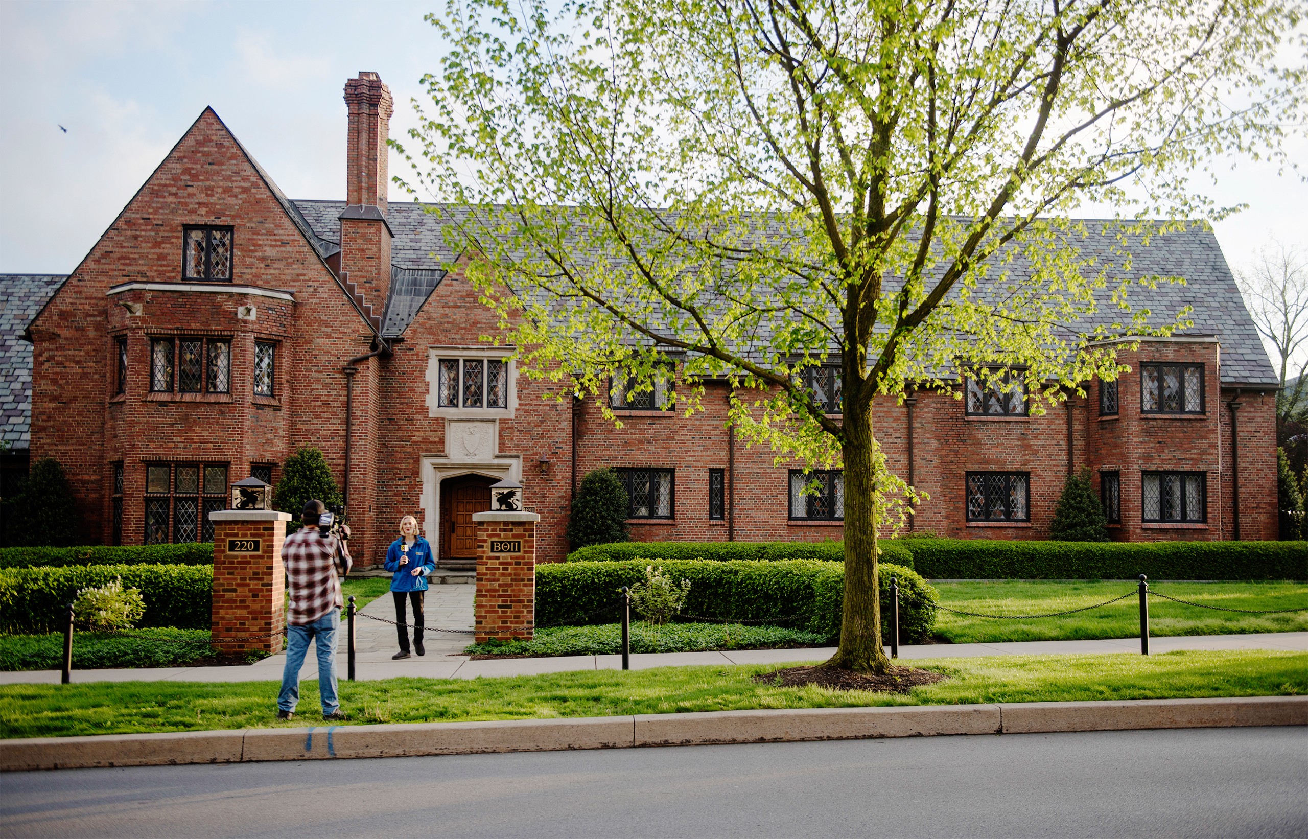 Reporters shoot a news standup outside the Penn State University Beta Theta Pi fraternity house on campus on May 5, 2017 in State College.