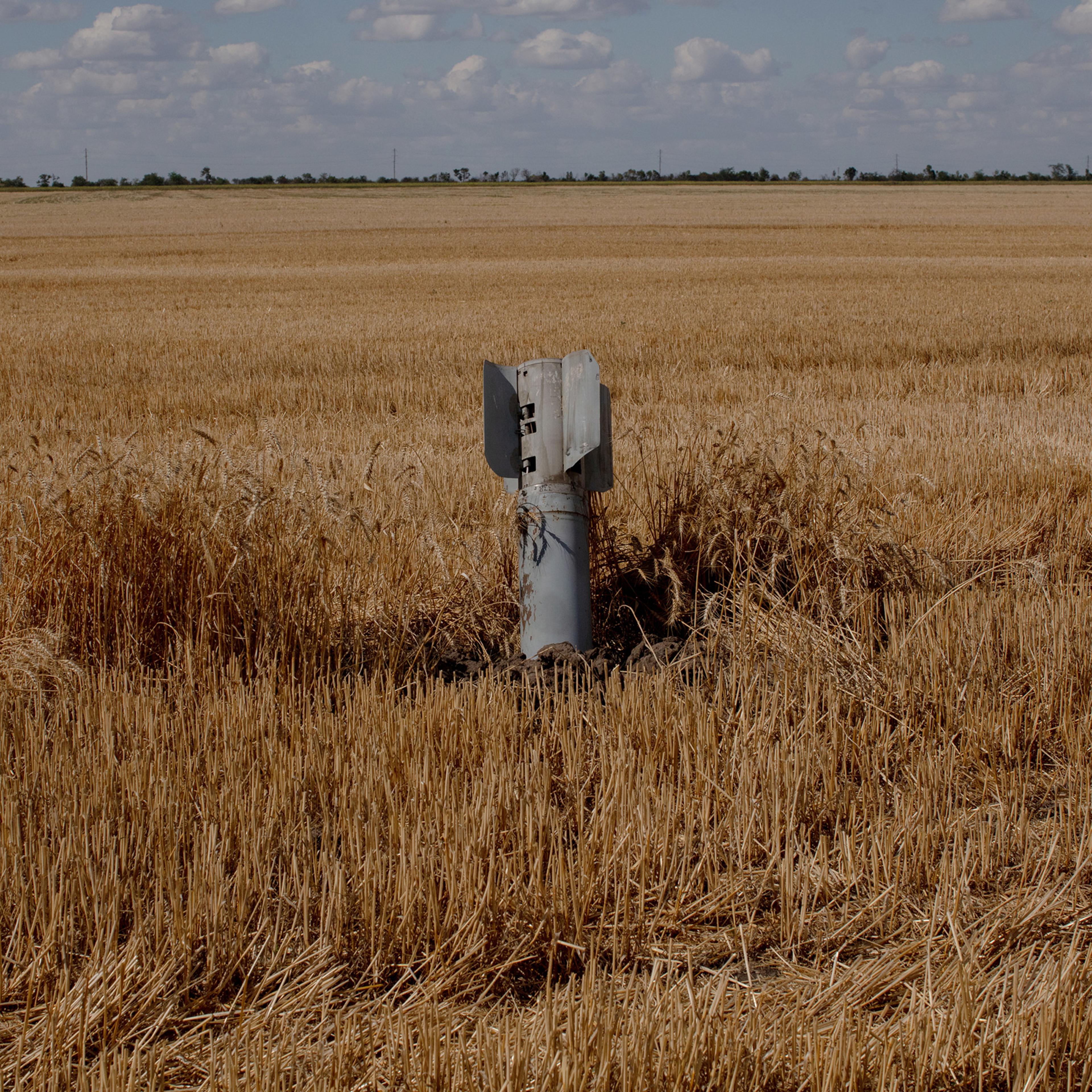 An unexploded rocket loaded with cluster munitions in a wheat field in Mykolaiv, Ukraine, on July 22. Nadiia runs a large farming operation between Mykolaiv city and Kherson, and her farm was on the front lines when Russia invaded the city at the start of the war before Ukrainians were able to push them back. Shelling in the area is a daily occurrence.