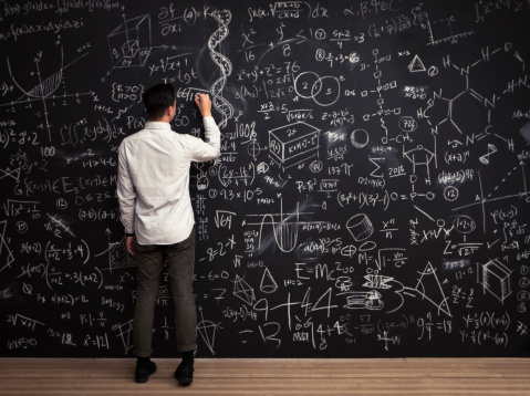 man-chalkboard-math-equations-rear-view