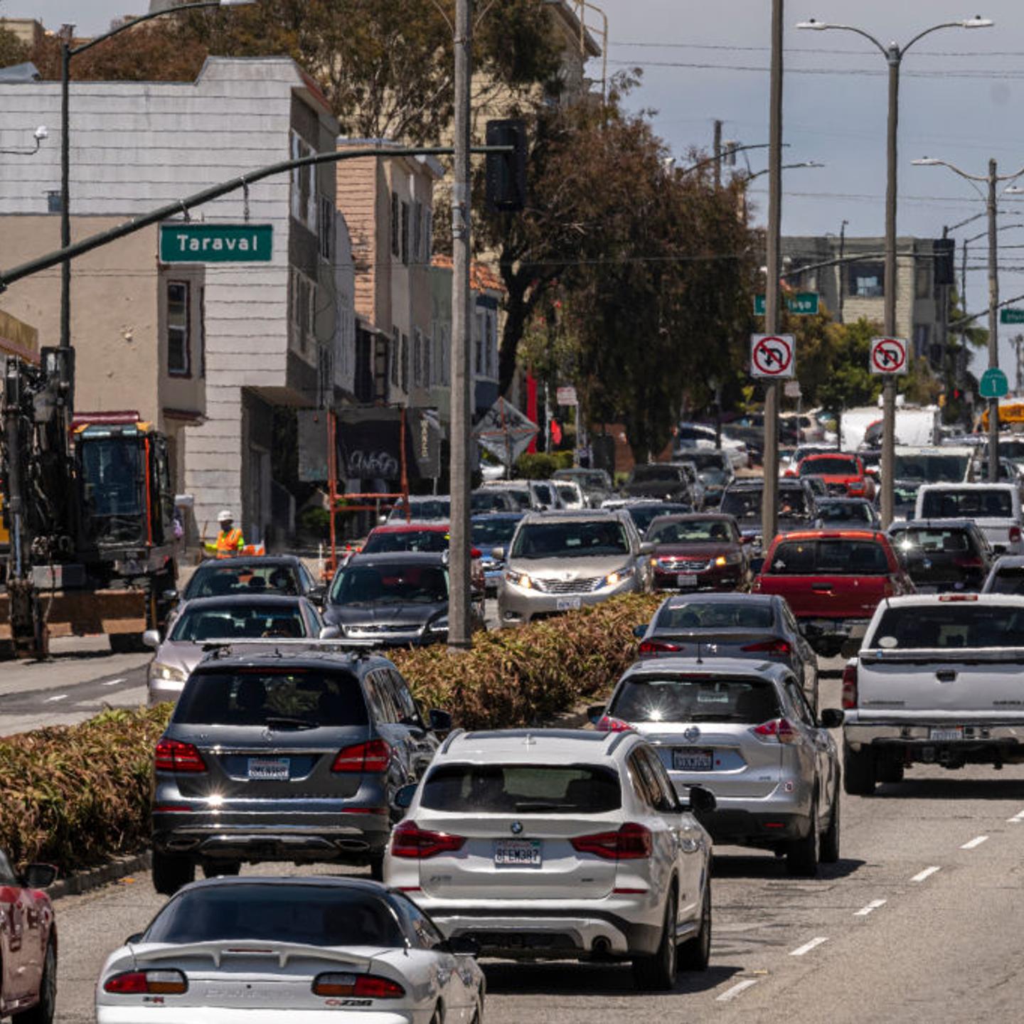 Traffic moves past a San Francisco gas station in early June.