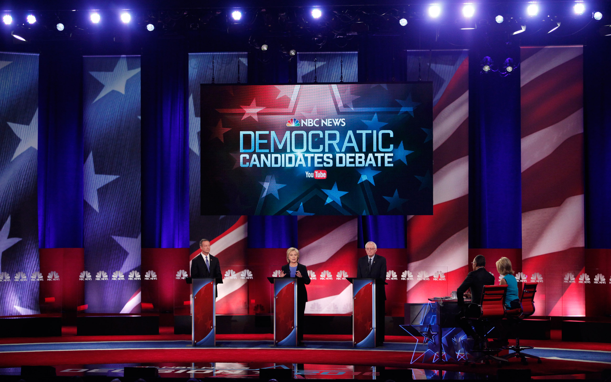 Democratic U.S. presidential candidates (L-R) former Governor Martin O'Malley, former Secretary of State Hillary Clinton and U.S. Senator Bernie Sanders begin to debate at the start of the NBC News - YouTube Democratic presidential candidates debate in C
