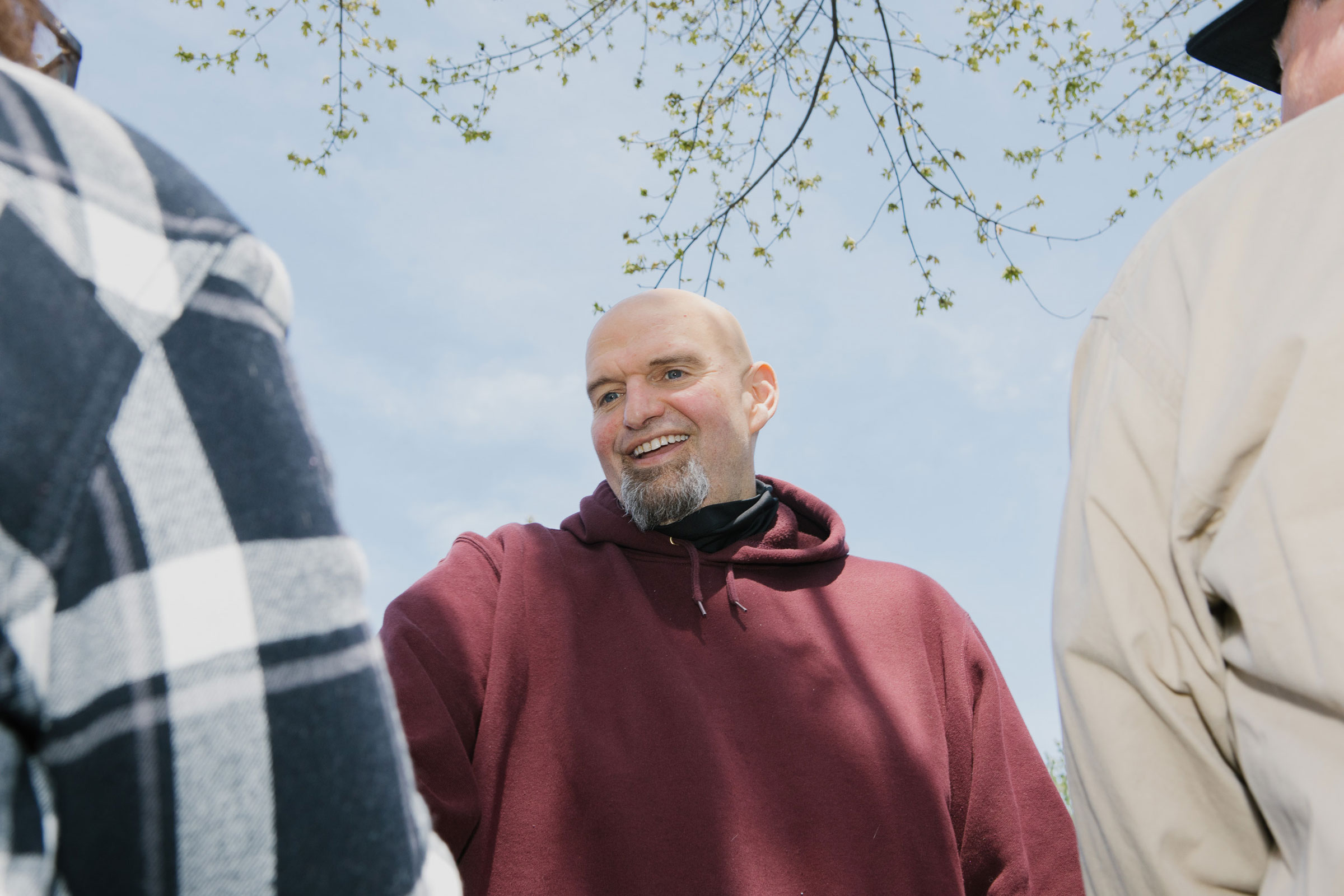 John Fetterman speaks with attendees during a campaign event
