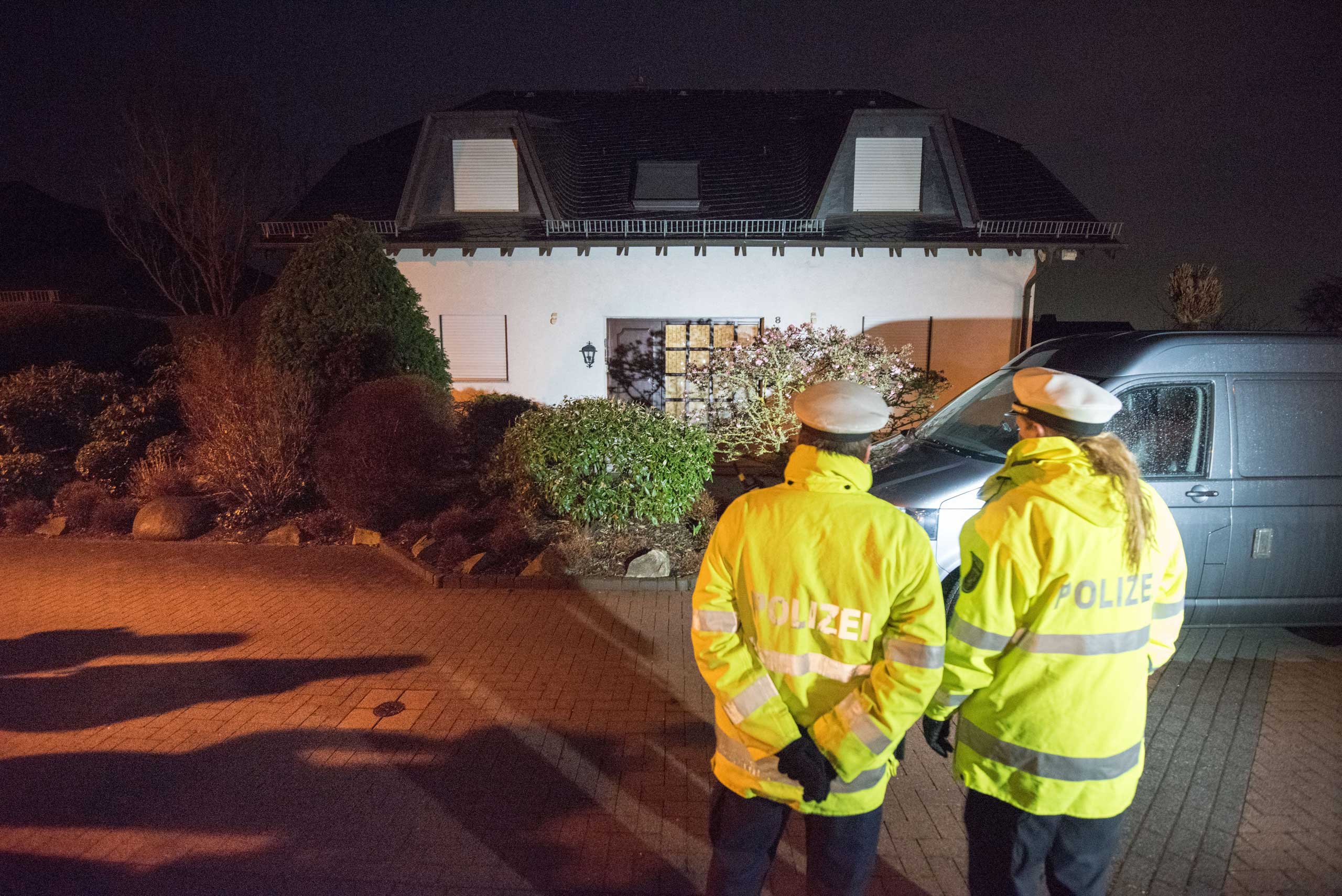 Police stand in front of the residence of the parents of Andreas Lubitz, co-pilot on Germanwings flight 4U9525, on March 26, 2015 in Montabaur, Germany.