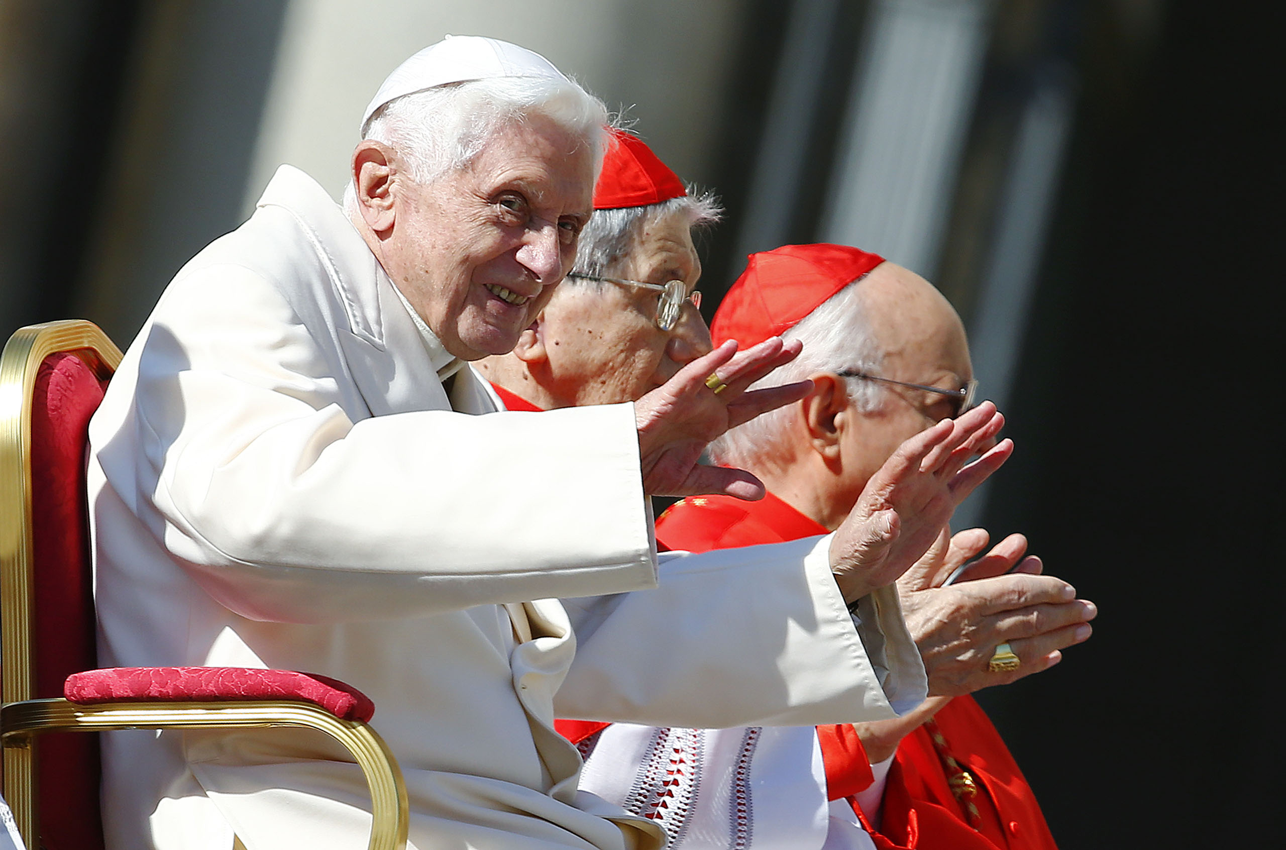 Emeritus Pope Benedict XVI waves before a mass in Saint Peter's square at the Vatican, Sept. 28, 2014.