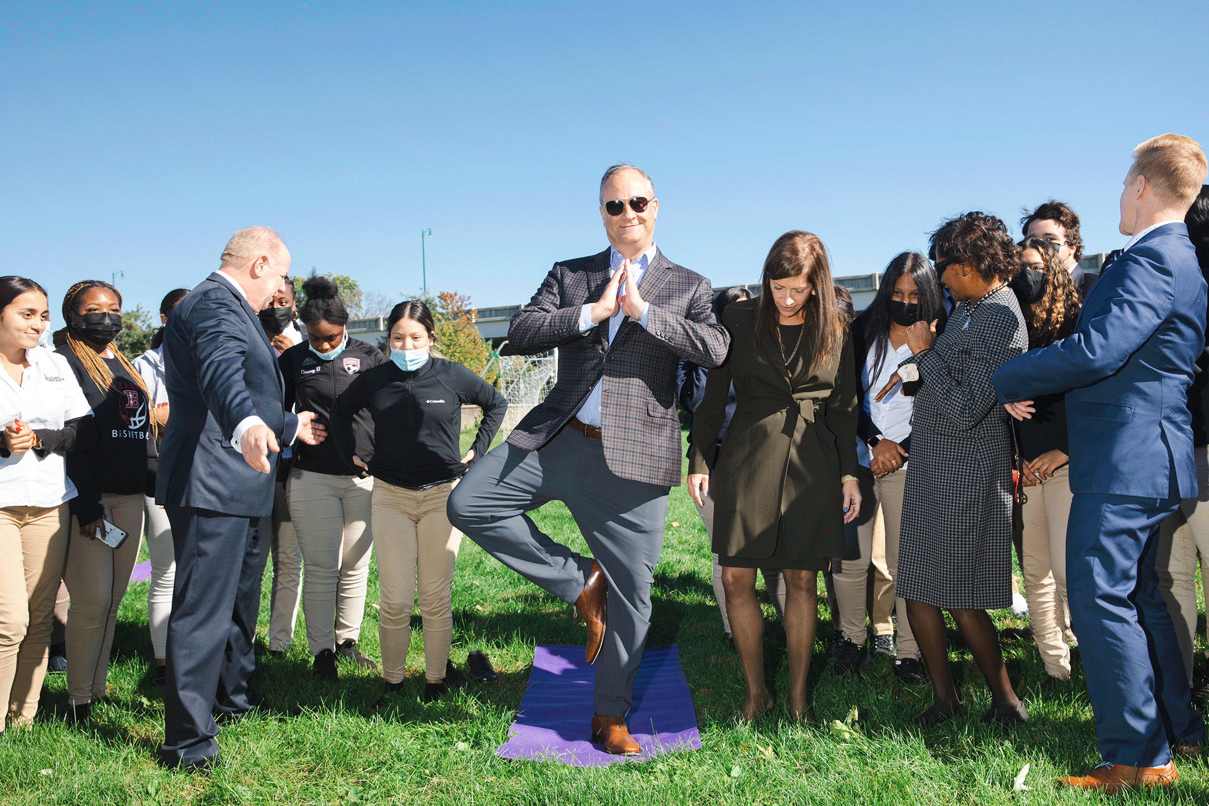 Emhoff practices his tree pose with a yoga class during a visit to New Jersey on Oct. 19, 2021. 