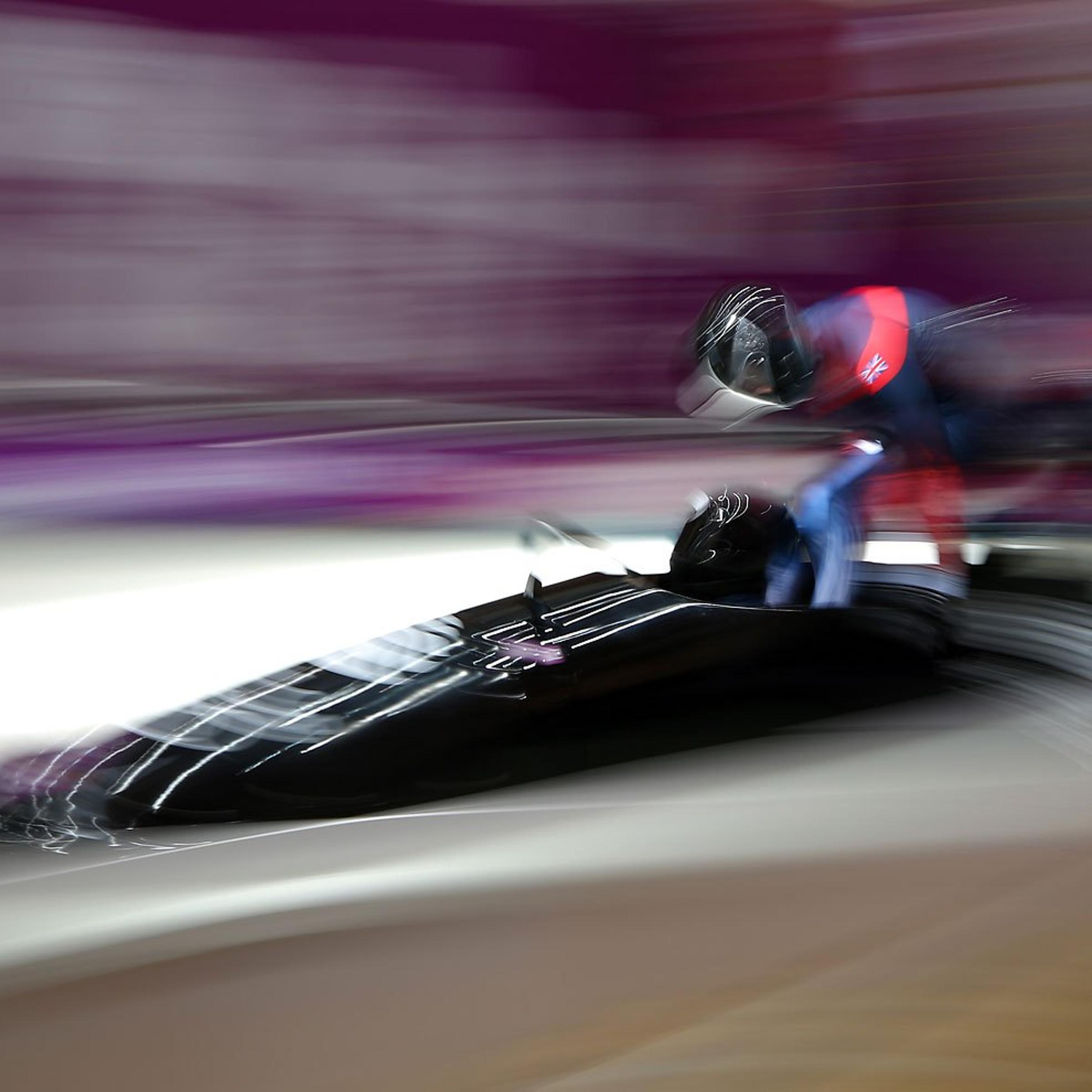 Lamin Deen, John Baines, Andrew Matthews and Ben Simons of Great Britain team 2 makea final run during the Men's Four Man Bobsleigh.
