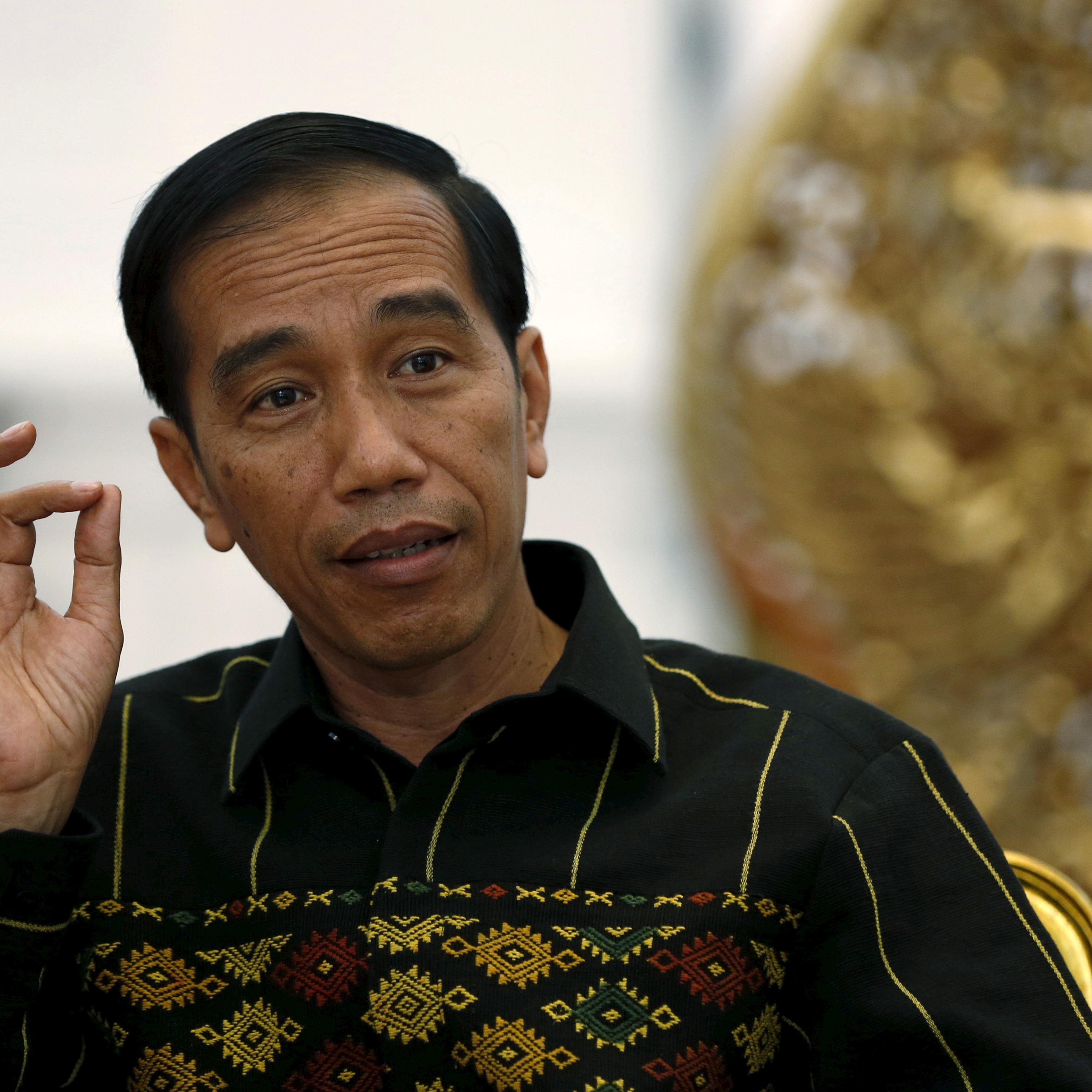 Indonesian President Joko Widodo gestures during an interview with Reuters at the Presidential Palace in Jakarta