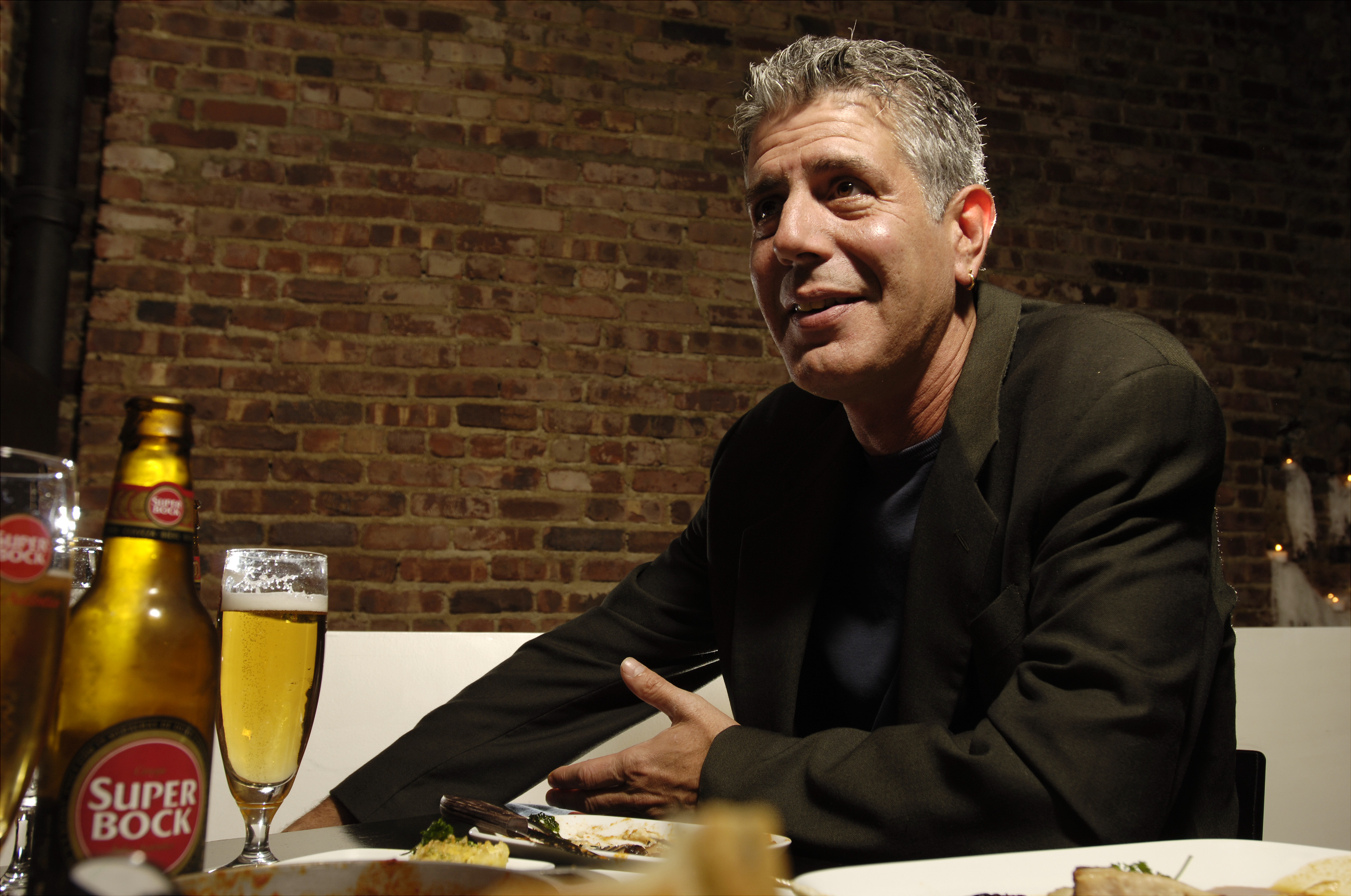 Chef Anthony Bourdain has a drink at Tintol restaurant in Ti