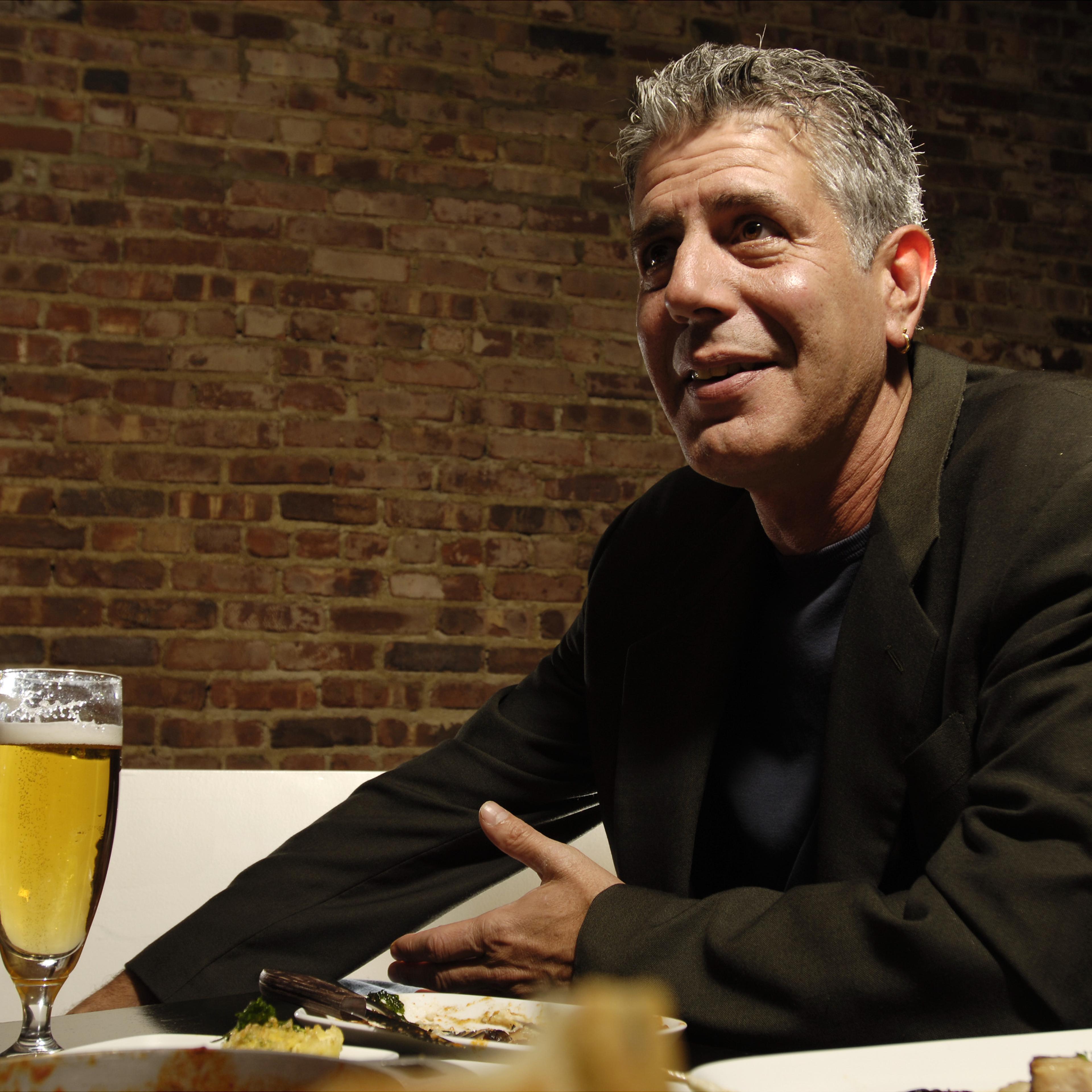 Chef Anthony Bourdain has a drink at Tintol restaurant in Ti