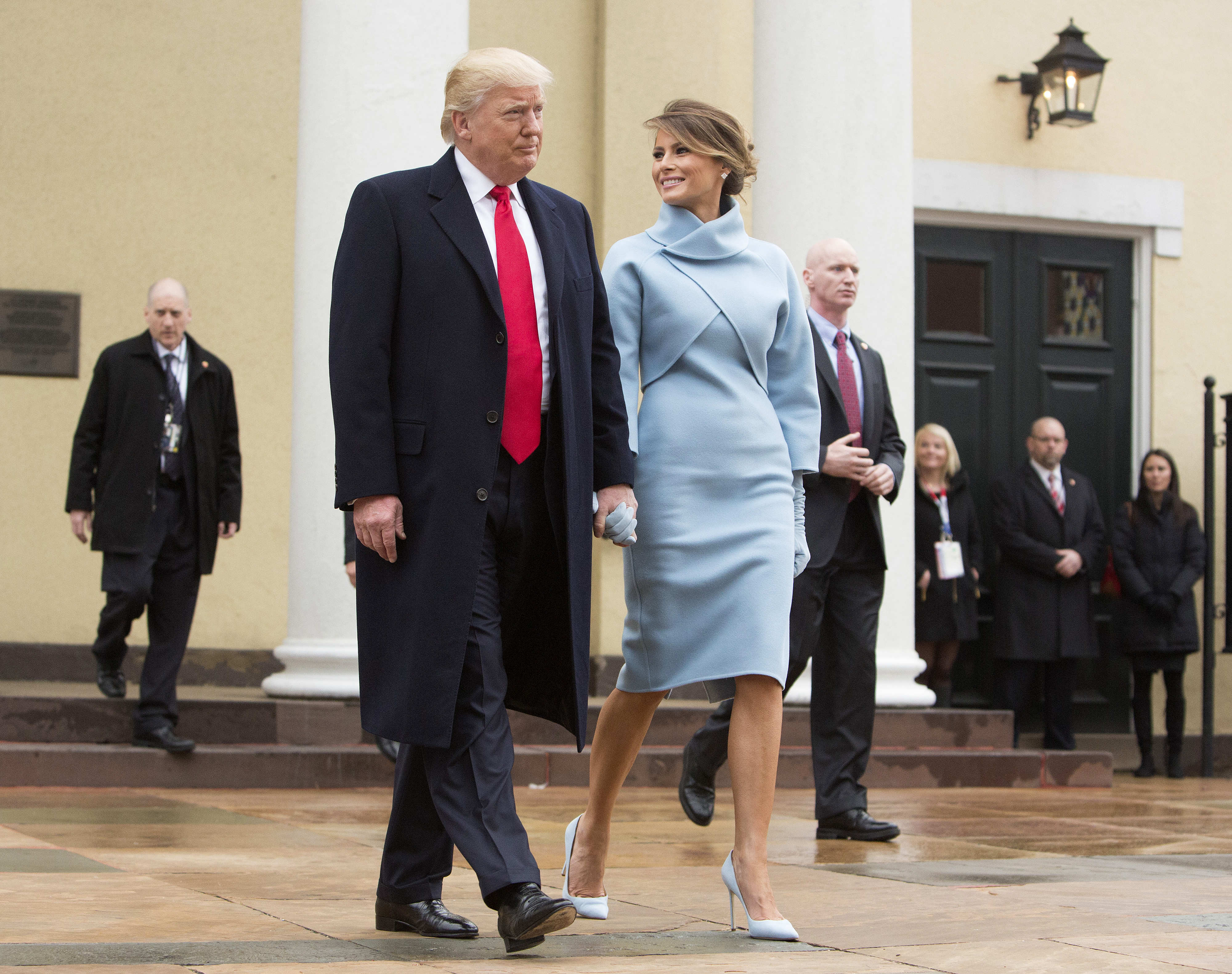 U.S. President-elect Donald Trump and wife Melania Trump depart St. John's Church ahead of the 58th presidential inauguration in Washington, D.C., U.S., on Friday, Jan. 20, 2017.