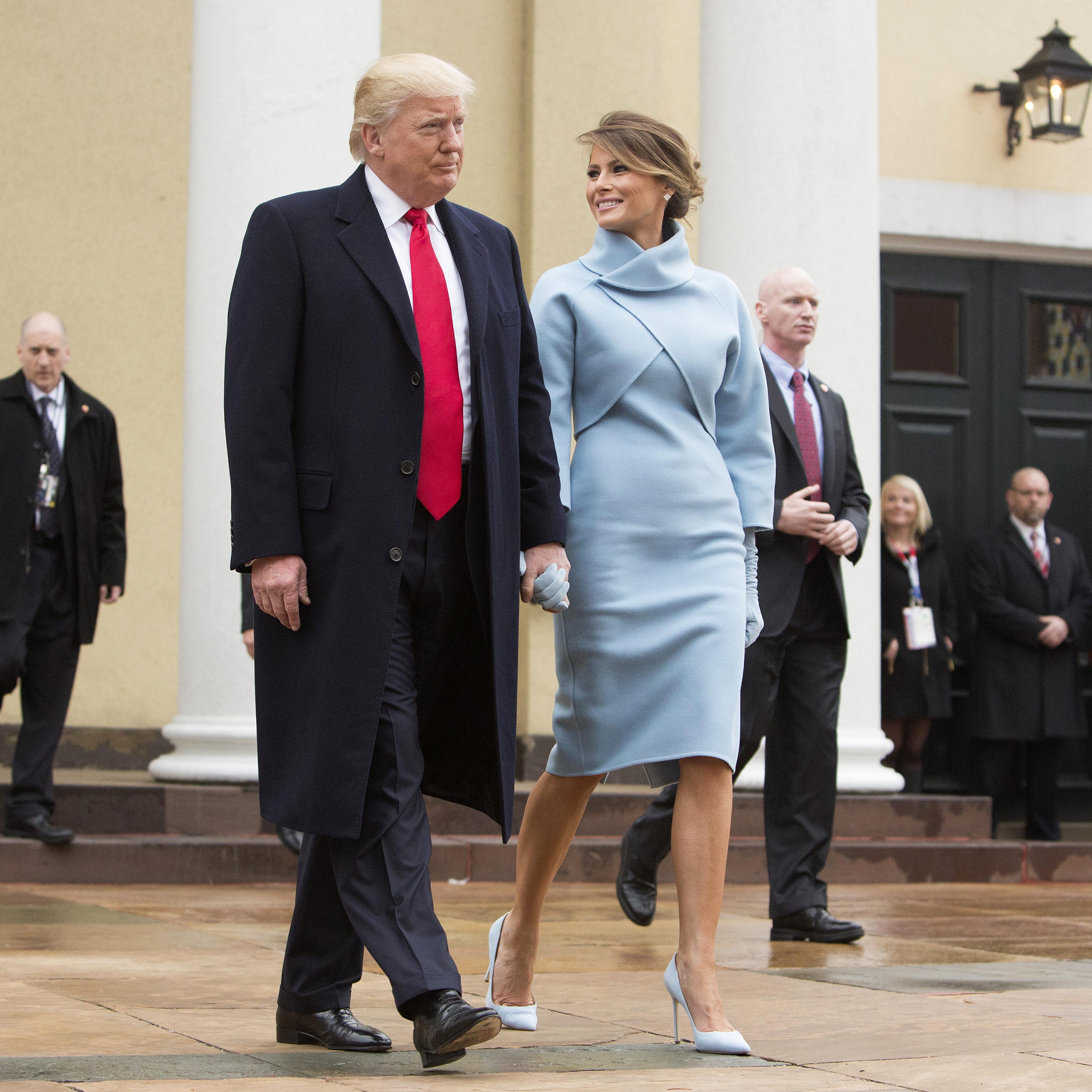 U.S. President-elect Donald Trump and wife Melania Trump depart St. John's Church ahead of the 58th presidential inauguration in Washington, D.C., U.S., on Friday, Jan. 20, 2017.