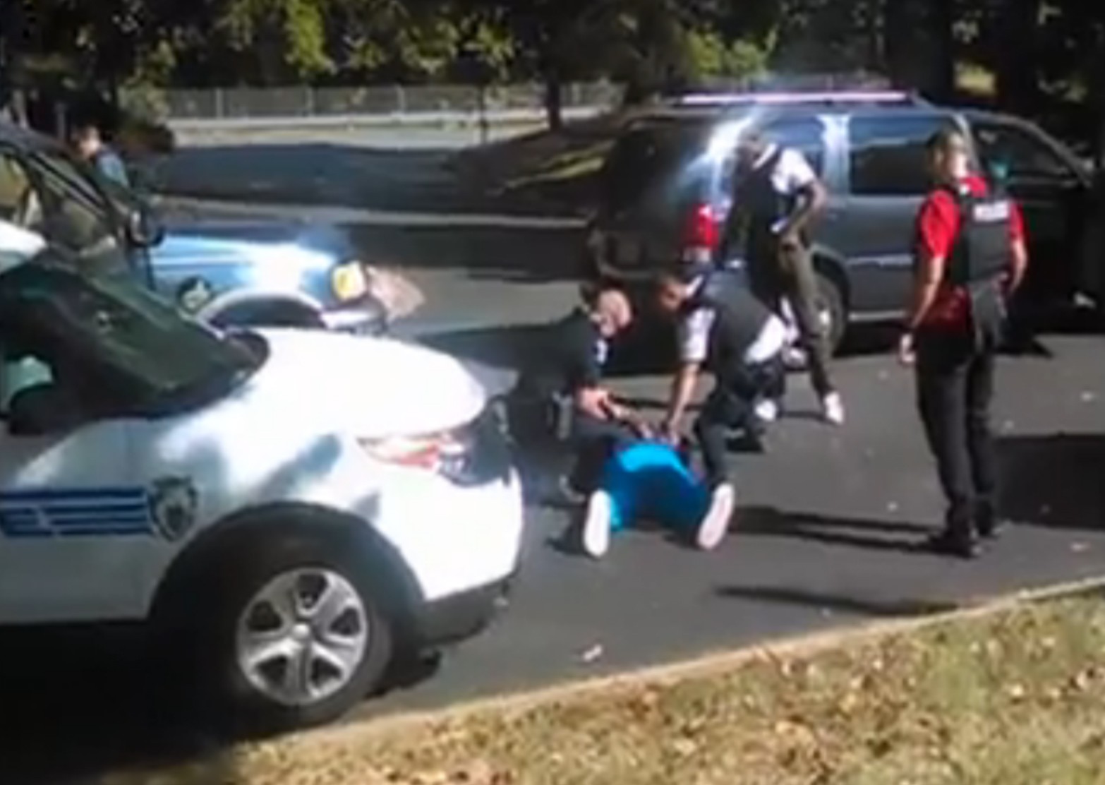 Keith Scott lies on the ground after being fatally shot by police in Charlotte, N.C., as seen in this still image taken from a video shot by his wife.