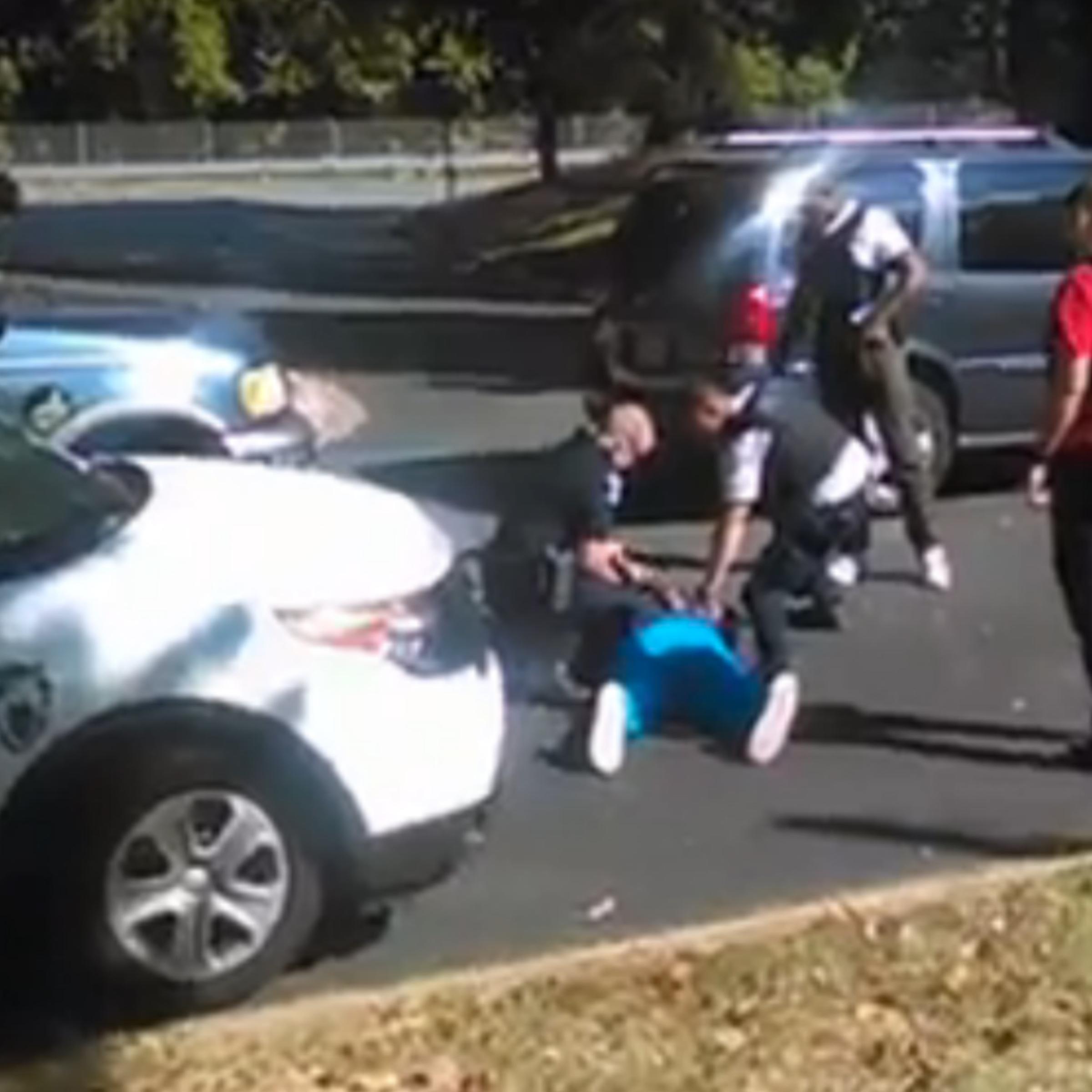 Keith Scott lies on the ground after being fatally shot by police in Charlotte, N.C., as seen in this still image taken from a video shot by his wife.