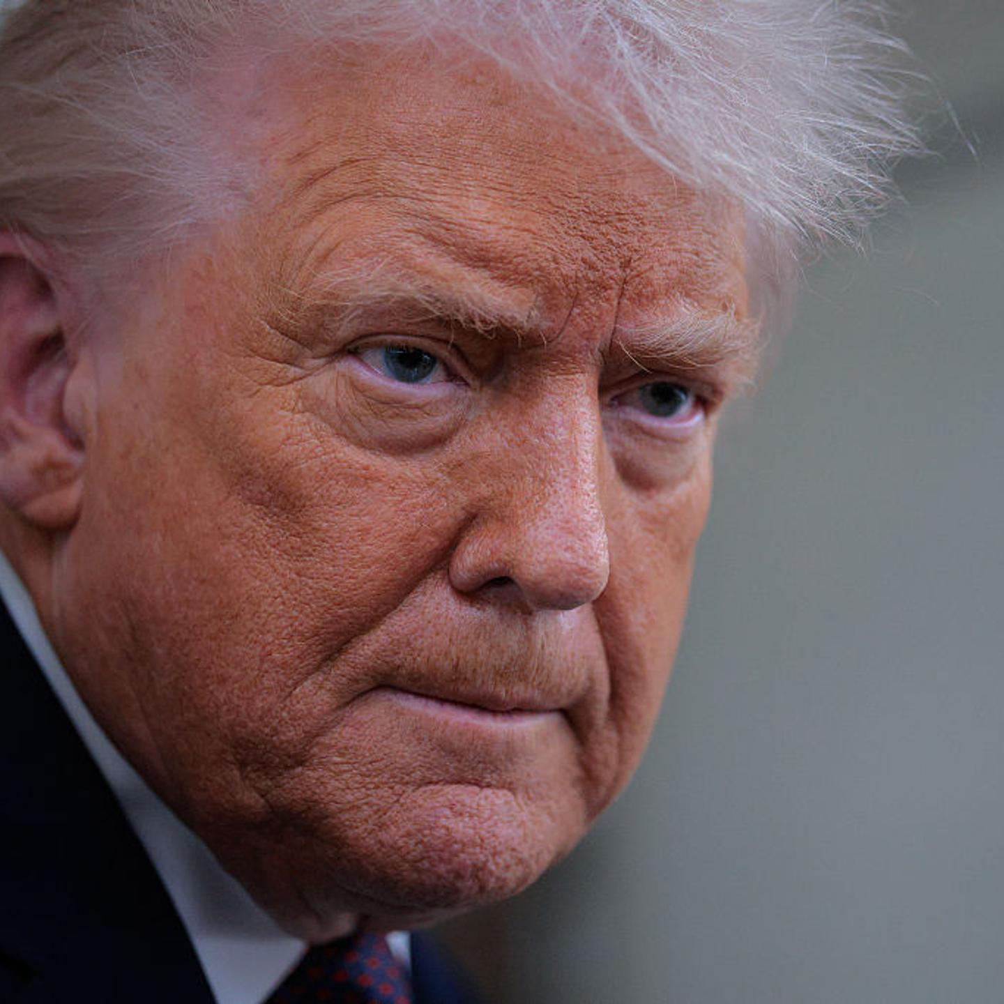 U.S. President Donald Trump speaks to reporters on board Air Force One while flying in between Ireland and Washington as he returns from the World Economic Forum on Jan. 22, 2026.