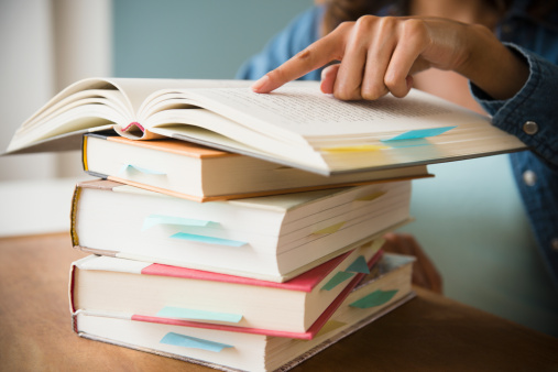 woman-finger-pointing-books