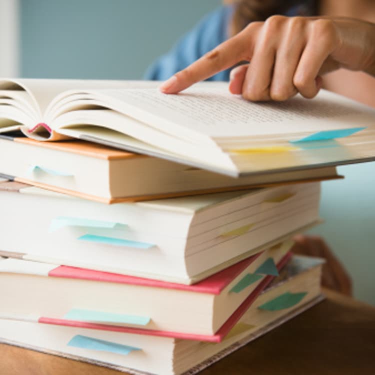 woman-finger-pointing-books