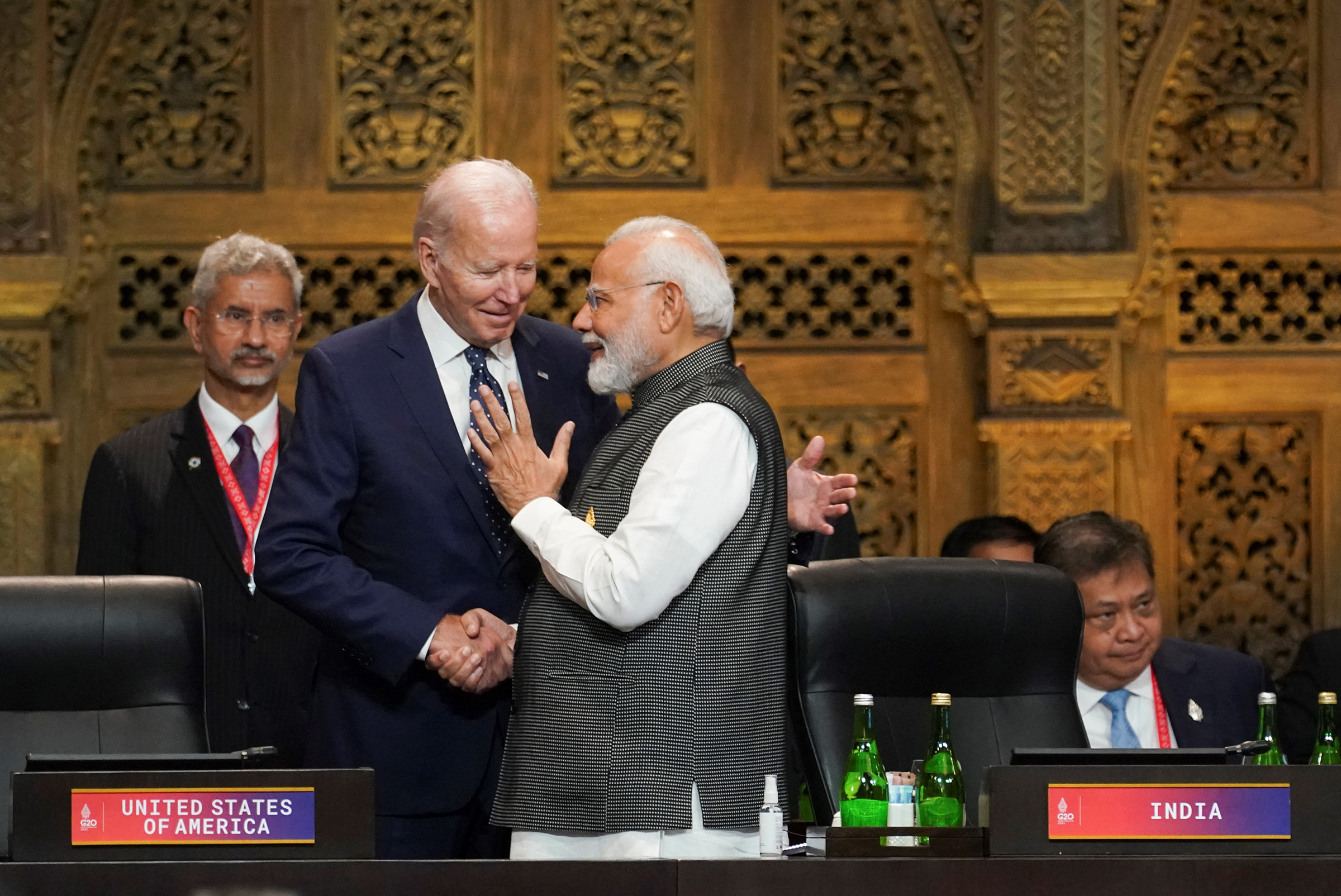 India's Prime Minister Narendra Modi (R) talks with US President Joe Biden (C) as India's Foreign Minister Subrahmanyam Jaishankar looks on during the first working session of the G20 leaders' summit in Nusa Dua, Bali, Indonesia on Nov. 15, 2022. 
