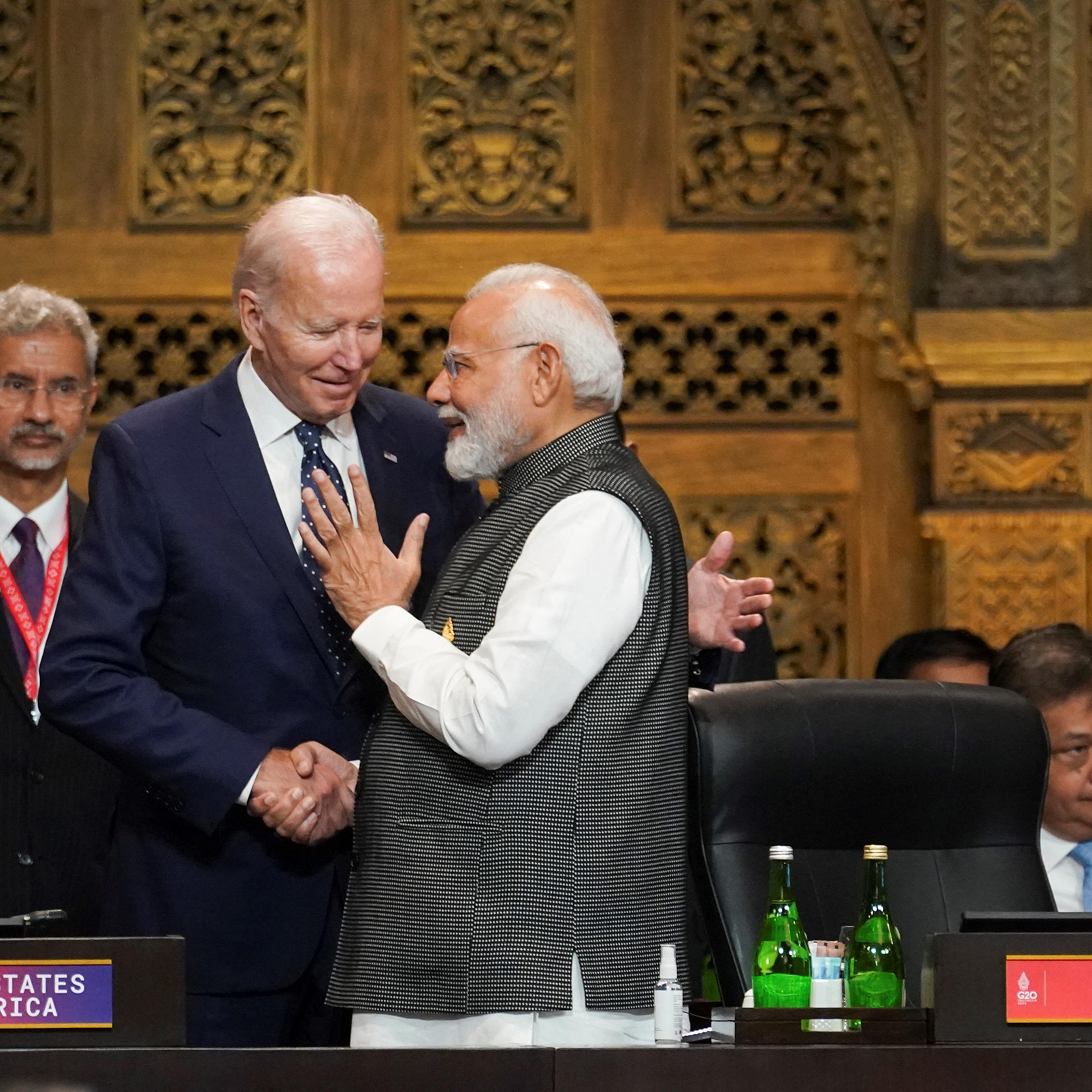 India's Prime Minister Narendra Modi (R) talks with US President Joe Biden (C) as India's Foreign Minister Subrahmanyam Jaishankar looks on during the first working session of the G20 leaders' summit in Nusa Dua, Bali, Indonesia on Nov. 15, 2022.