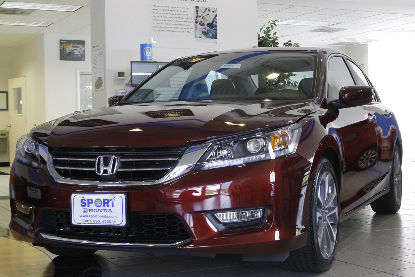 A new 2013 Honda Accord is shown on the sales floor at Sport Honda in Silver Spring, Maryland Sept. 17, 2012.