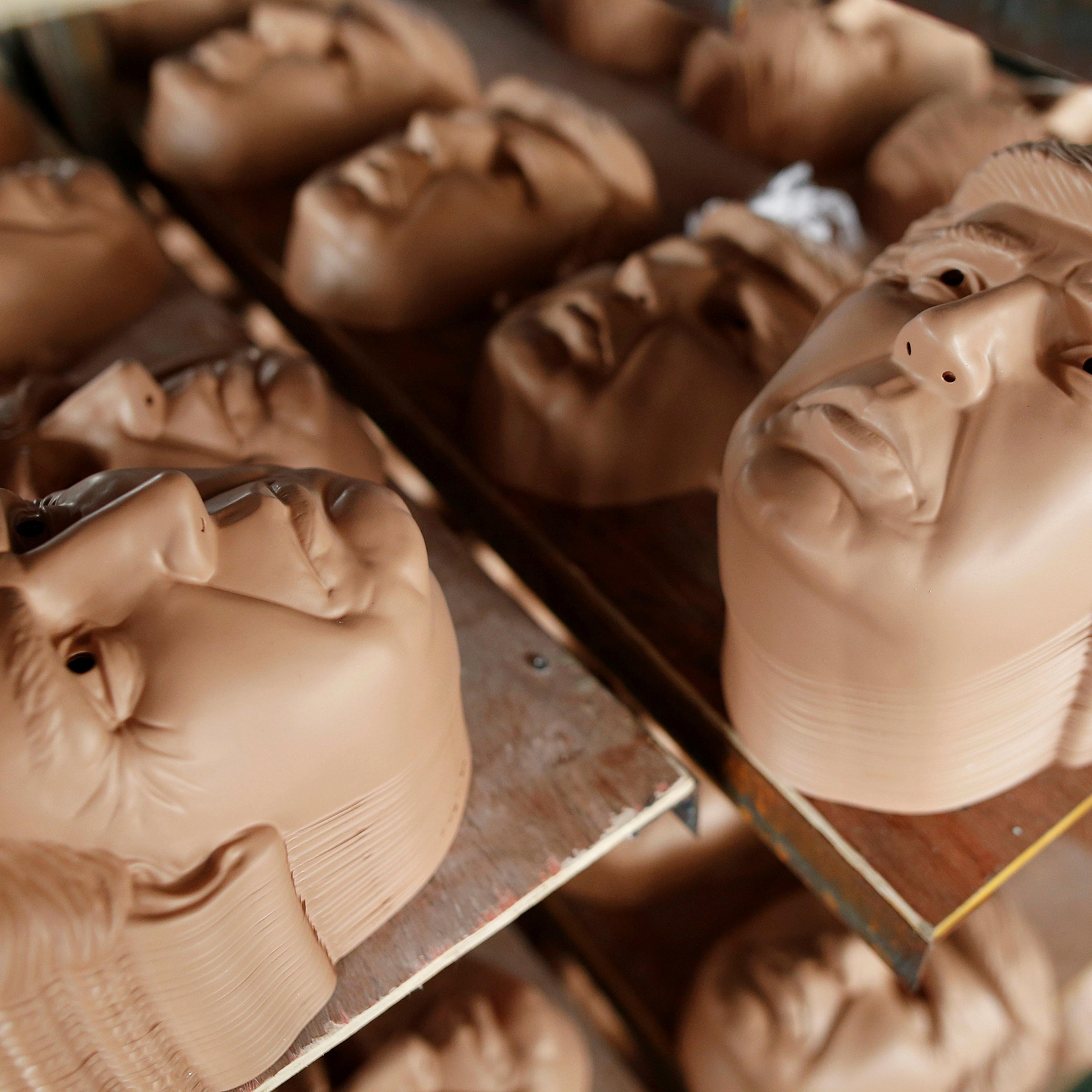 Masks of Republican presidential candidate Donald Trump dry on shelves at Jinhua Partytime Latex Art and Crafts Factory in Jinhua, Zhejiang Province, China, May 25, 2016.
