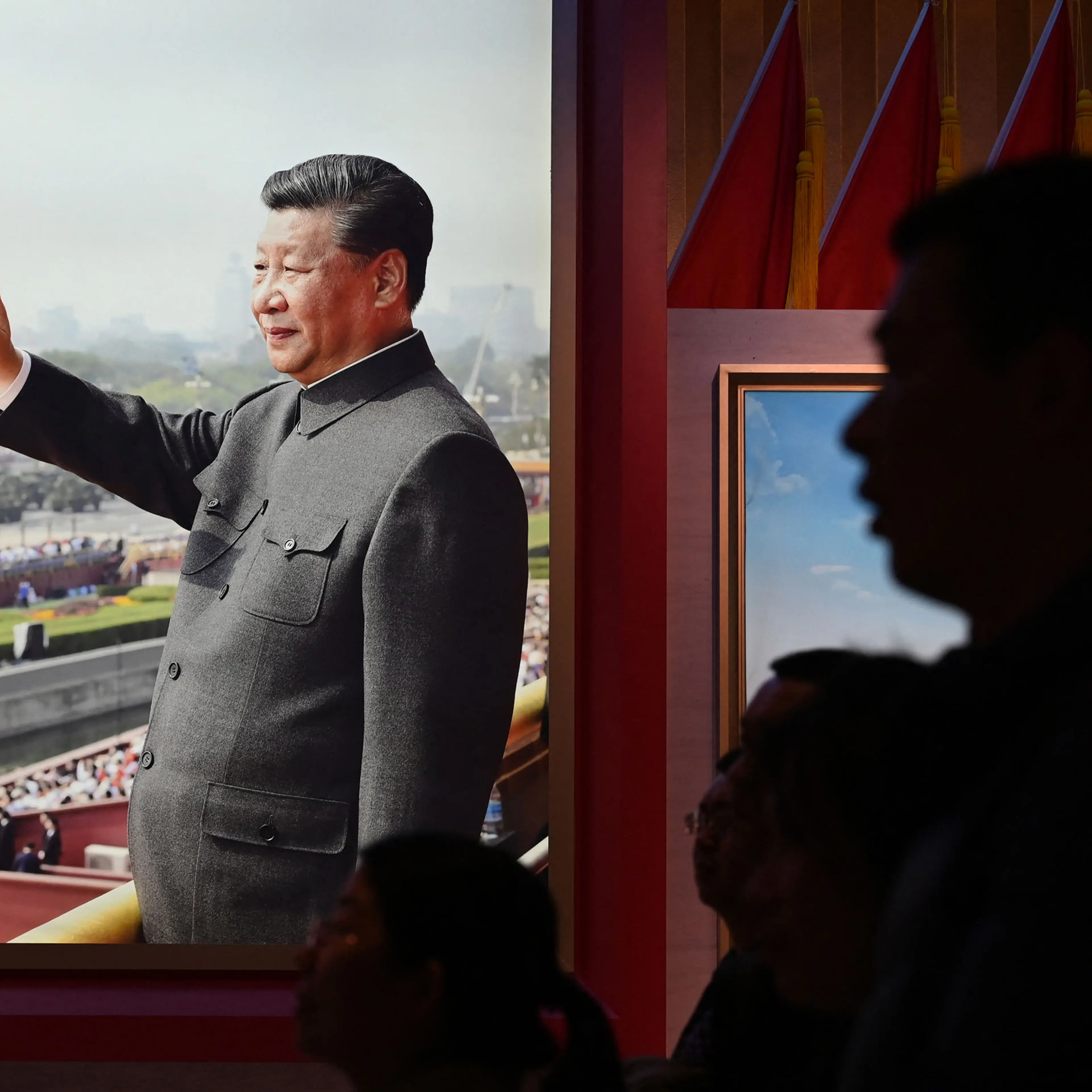 People look at an exhibition featuring Chinese President Xi Jinping at the Military Museum in Beijing on March 3, 2024.