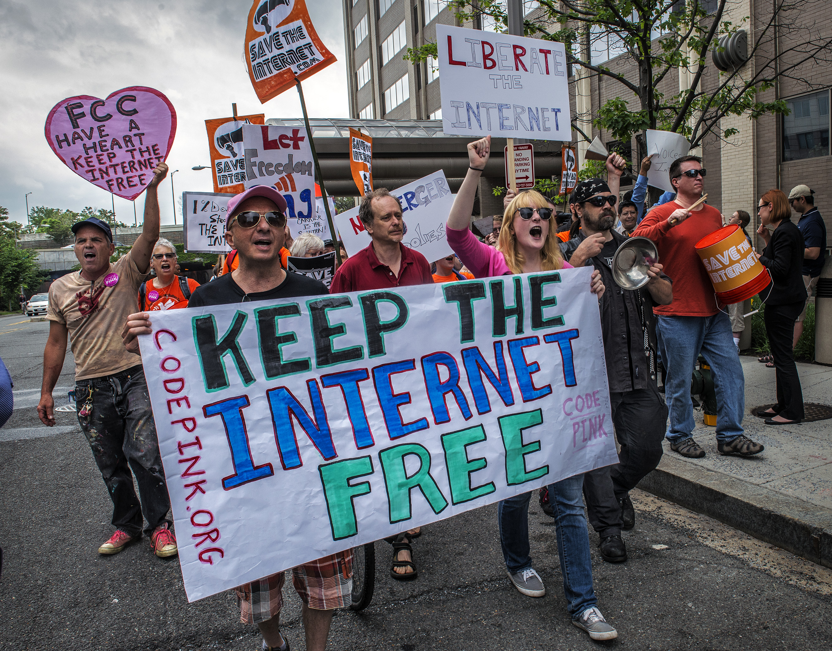 Protesters hold a rally before the FCC meeting on net neutrality proposal in Washington, DC.