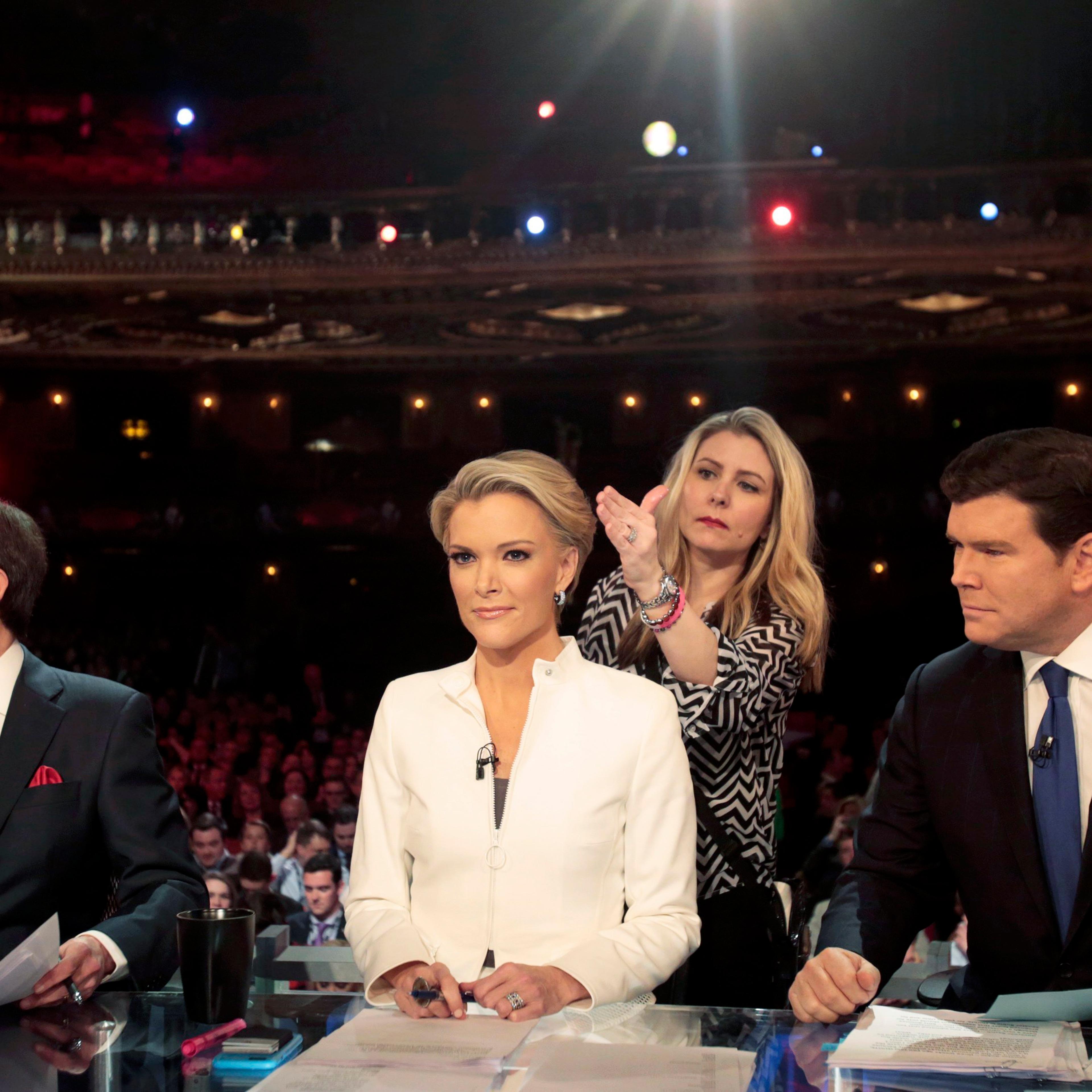 Fox News Channel anchors Wallace, Kelly and Baier prepare to moderate at the U.S. Republican presidential candidates debate in Detroit