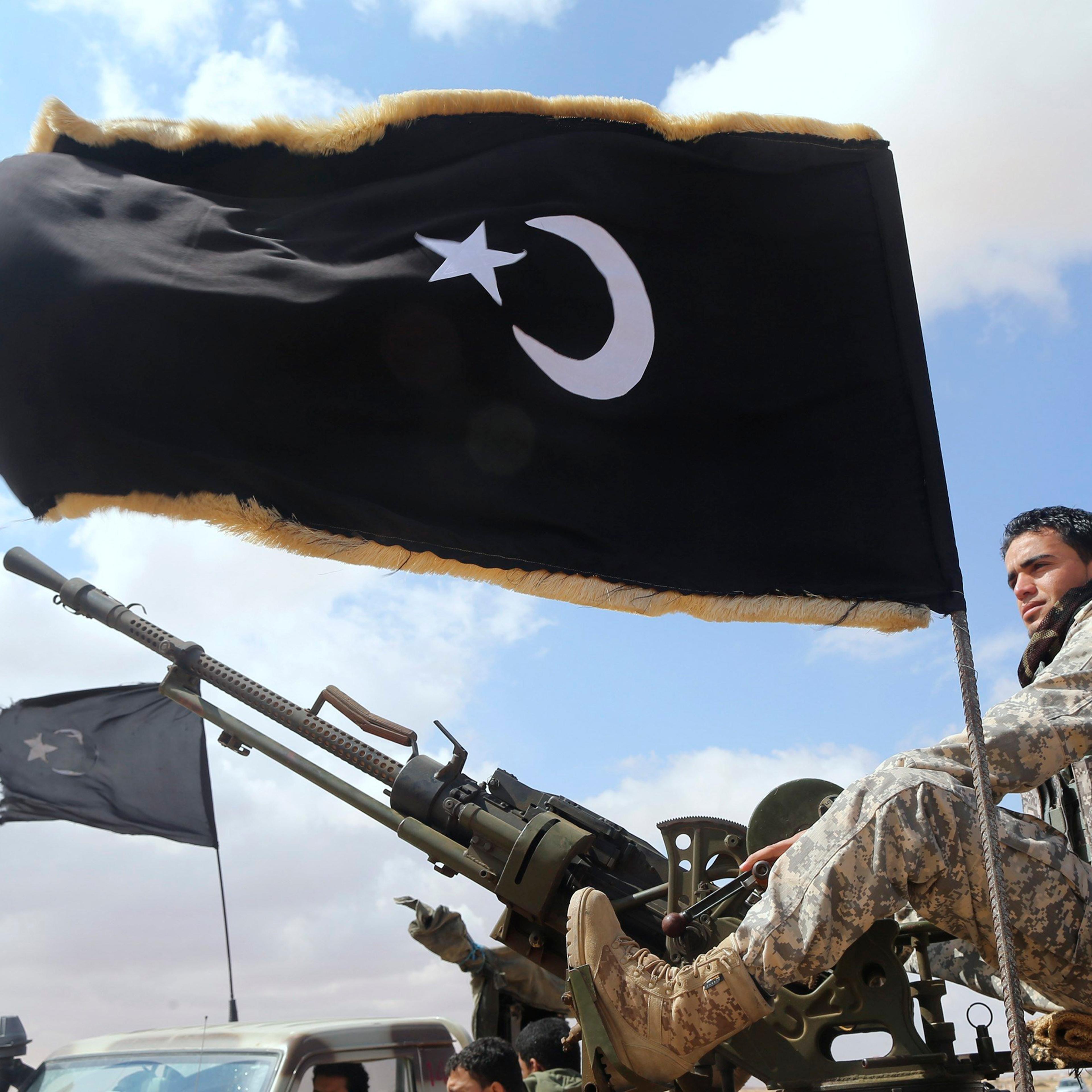 A rebel under Ibrahim Jathran guards the entrance of Es Sider port in Ras Lanuf