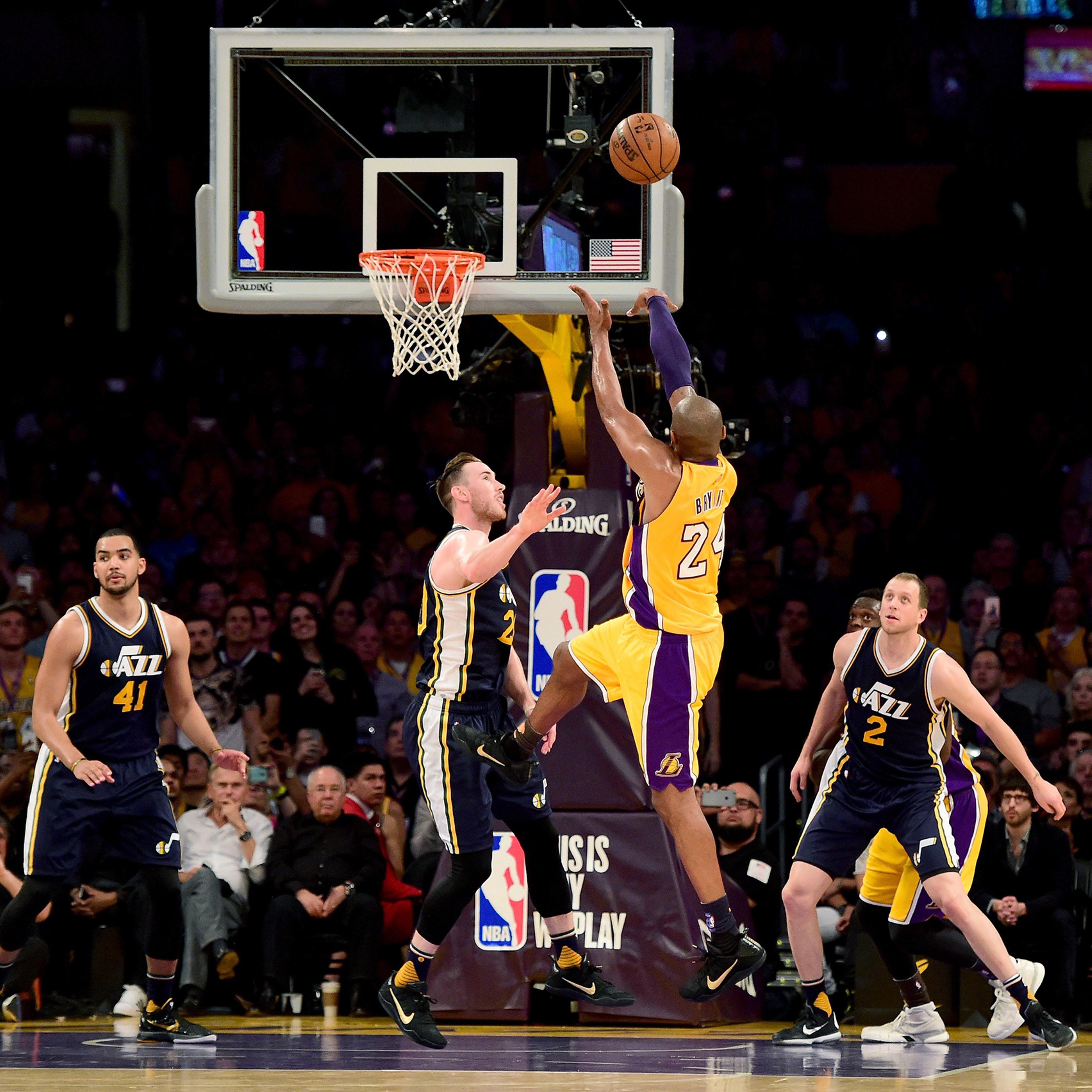 Kobe Bryant of the Los Angeles Lakers shoots over Gordon Hayward of the Utah Jazz in the first half at the Staples Center in Los Angeles, April 13, 2016.