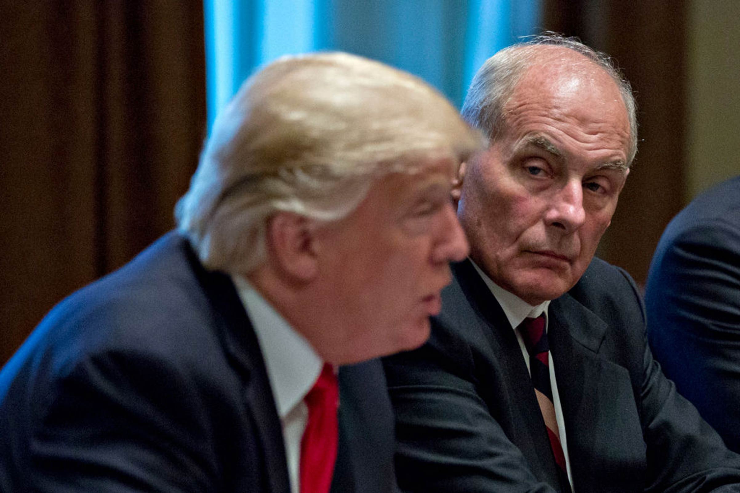 White House Chief of Staff John Kelly listens as President Trump speaks at a briefing with senior military leaders in the Cabinet Room of the White House on Oct. 5, 2017.