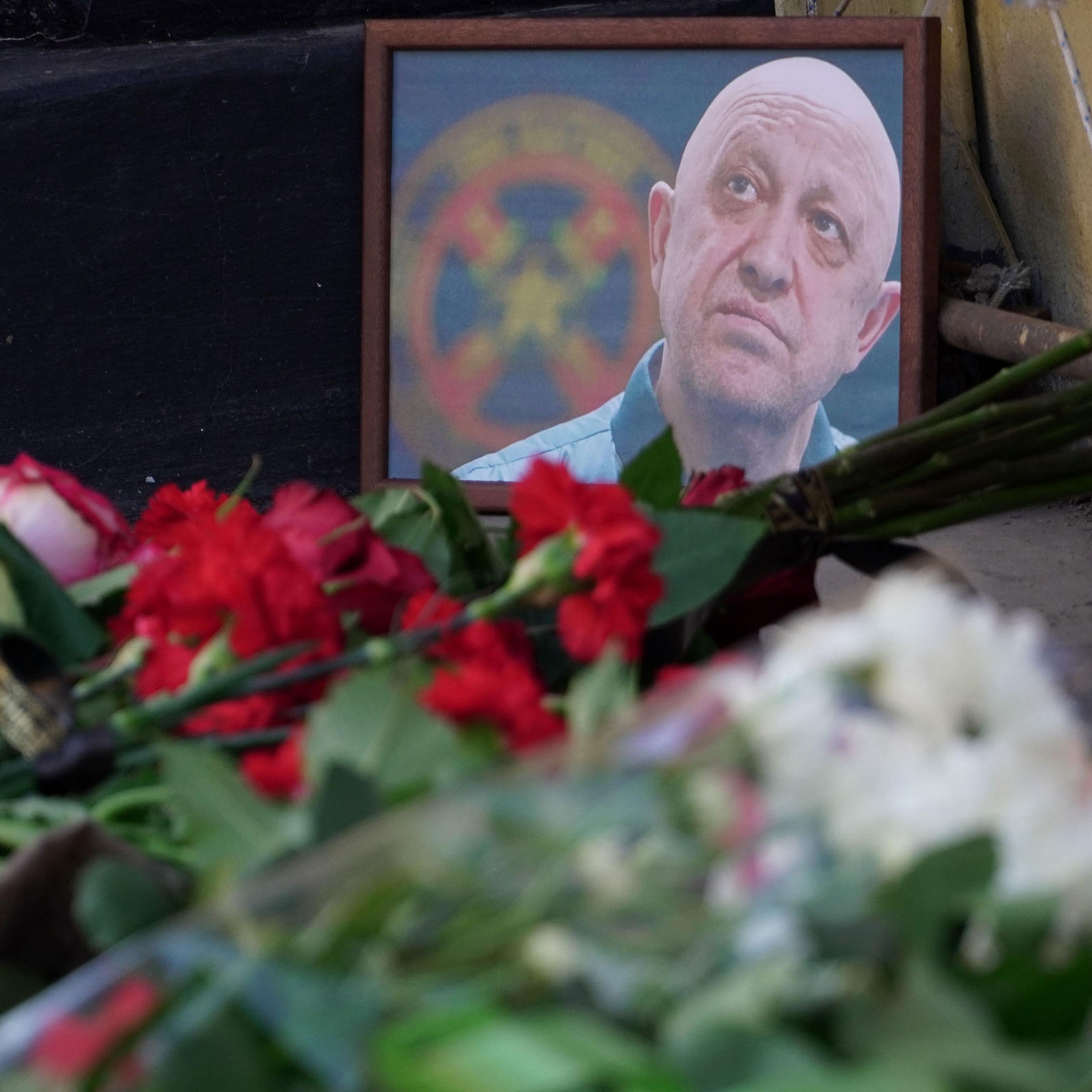 A portrait of Yevgeny Prigozhin is seen at the makeshift memorial