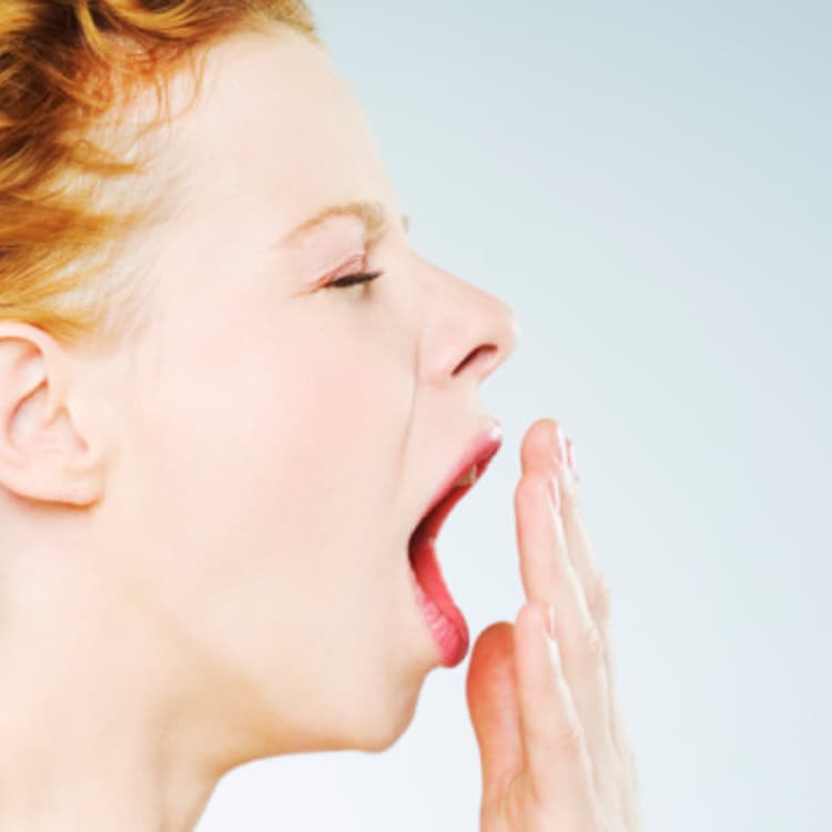 woman-yawning-side-view