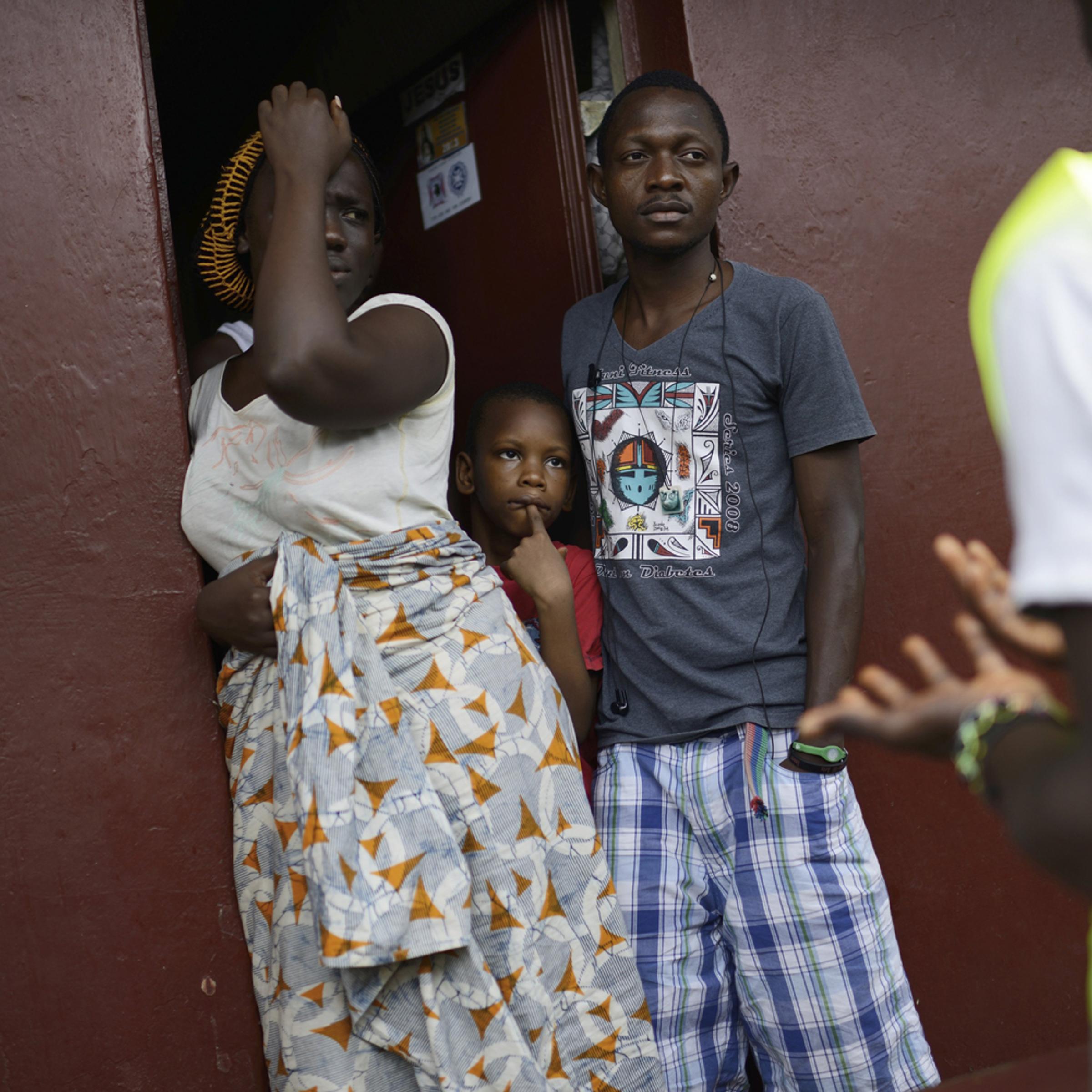 A group of volunteers inform residents about Ebola and a lockdown in the Brookfield neighborhood of Freetown, Sierra Leone, Sept. 19, 2014.