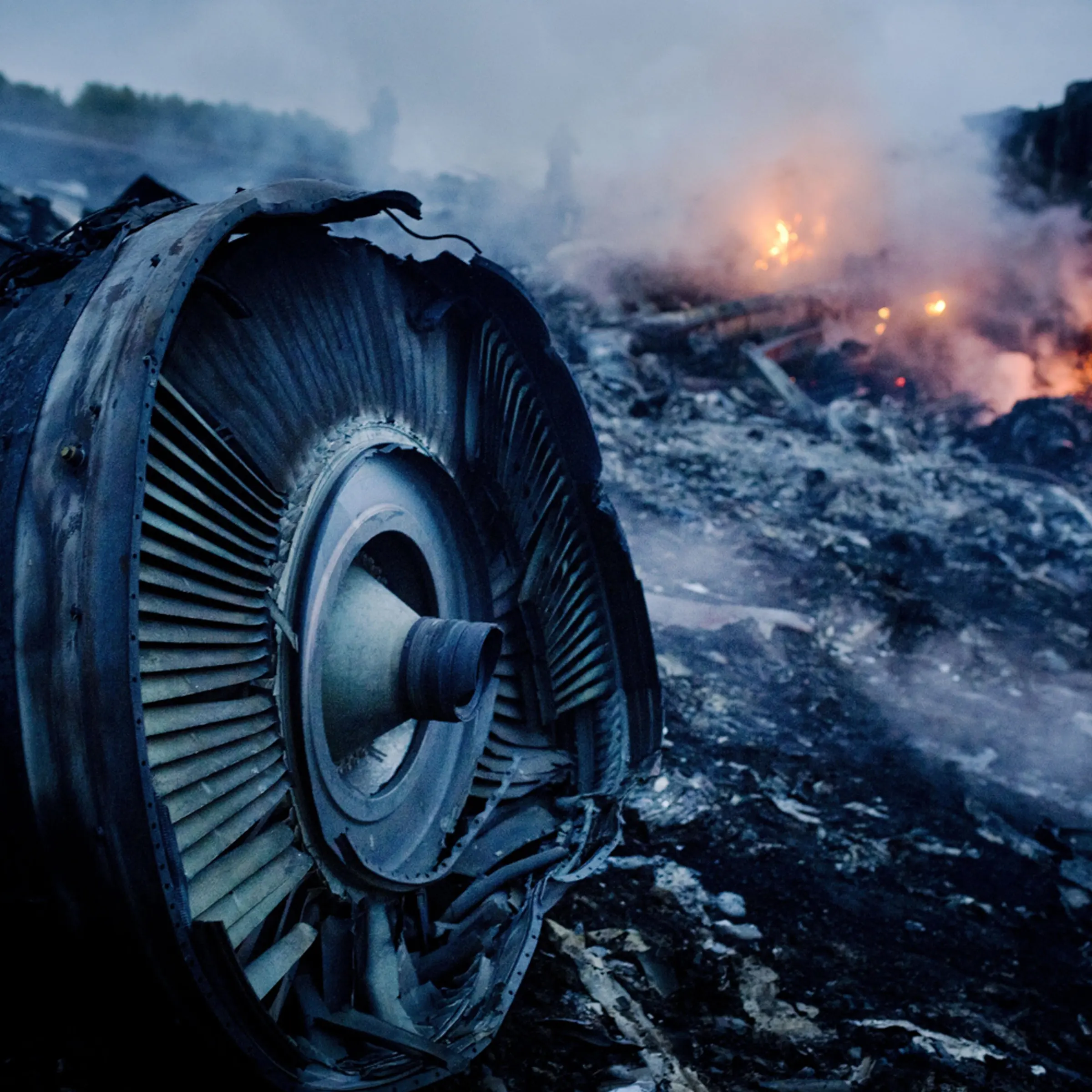 Debris from Malaysia Airlines Flight 17 is shown smouldering in a field July 17, 2014 in Grabovo, Ukraine.