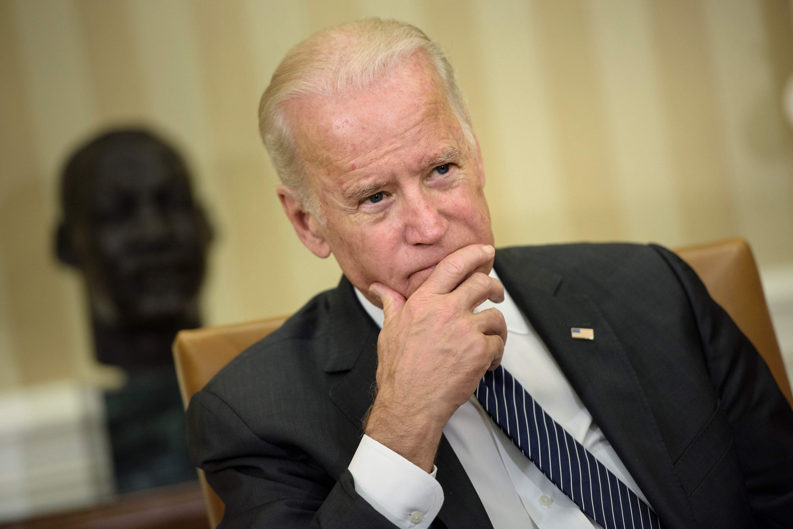 Vice President Joe Biden listens as Barack Obama speaks after a meeting about the Zika virus in the Oval Office of the White House in Wahington, D.C. on May 21, 2016.