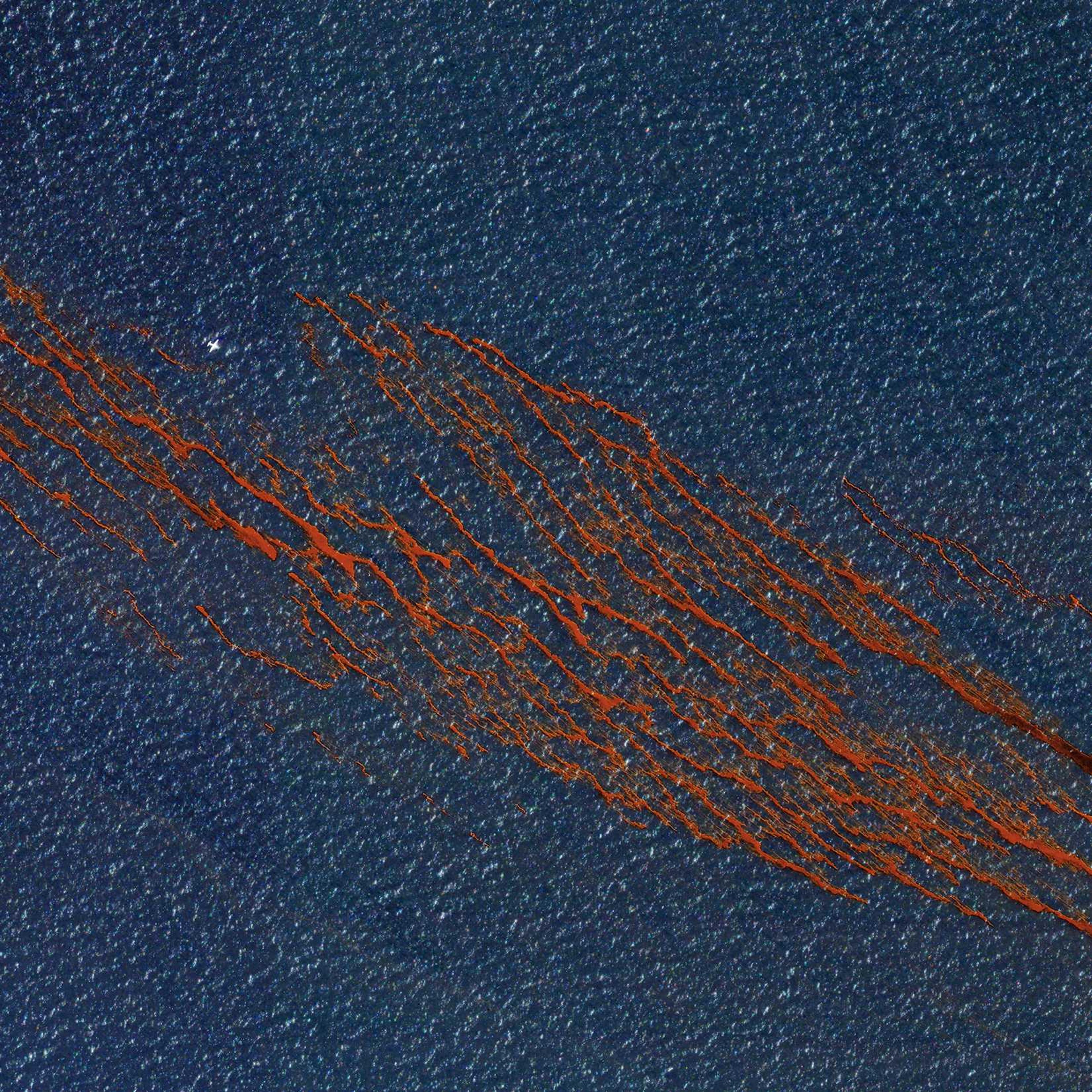 This DigitalGlobe satellite image depicts an oil slick in the Gulf of Mexico caused by the sinking of Deepwater Horizon, a semi-submersible rig whose purpose was to drill oil wells in extremely deep water.