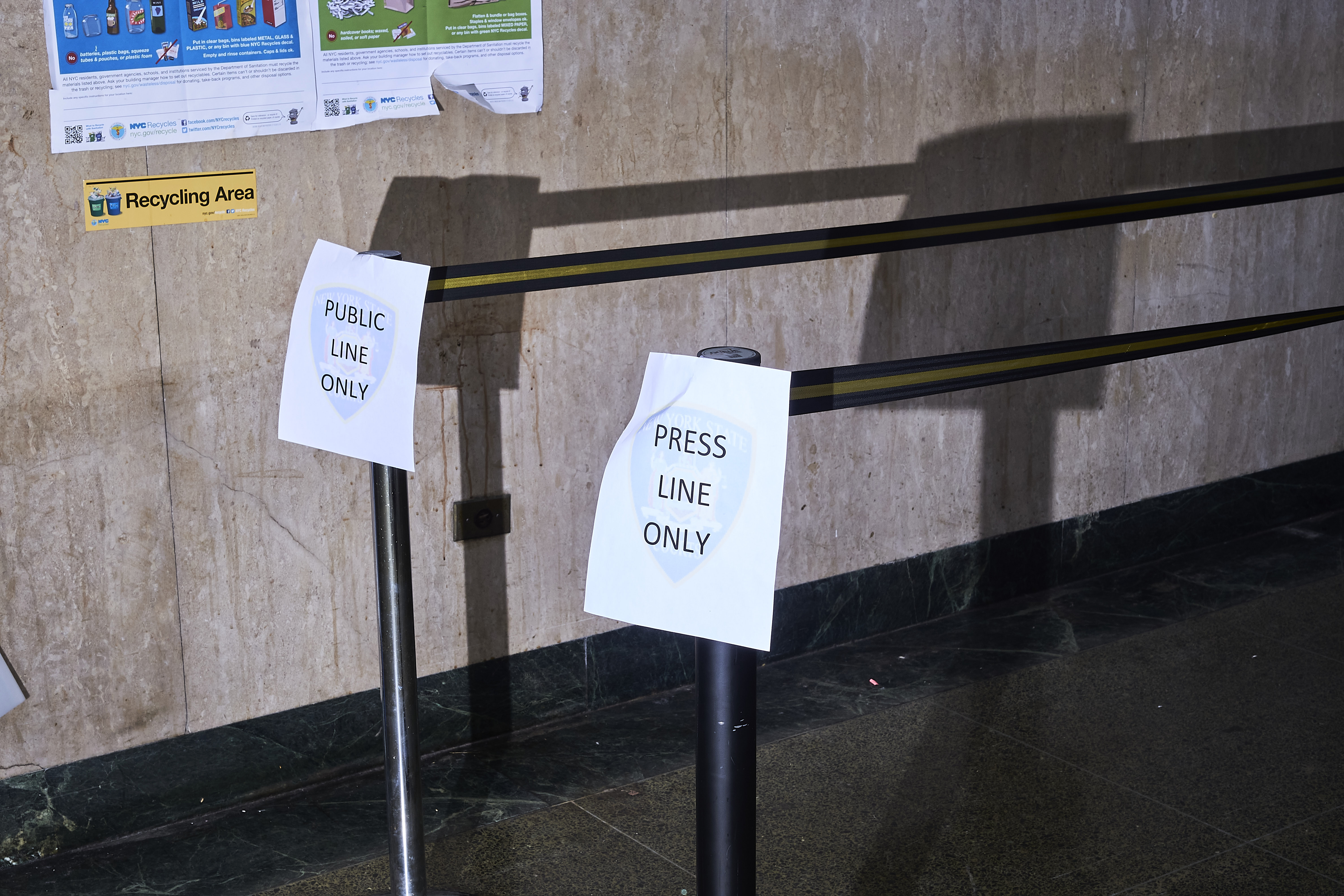 Signs in the Manhattan Criminal Court hallway designate public and press lines, Jan. 8, 2020.