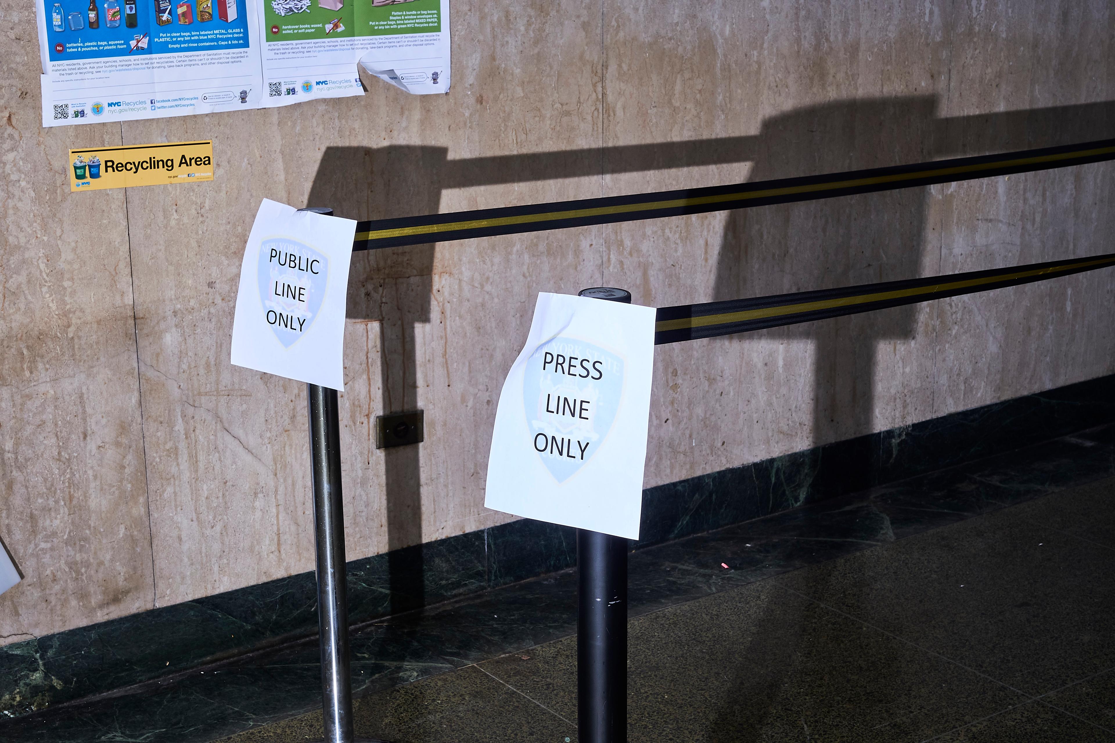 Signs in the Manhattan Criminal Court hallway designate public and press lines, Jan. 8, 2020.