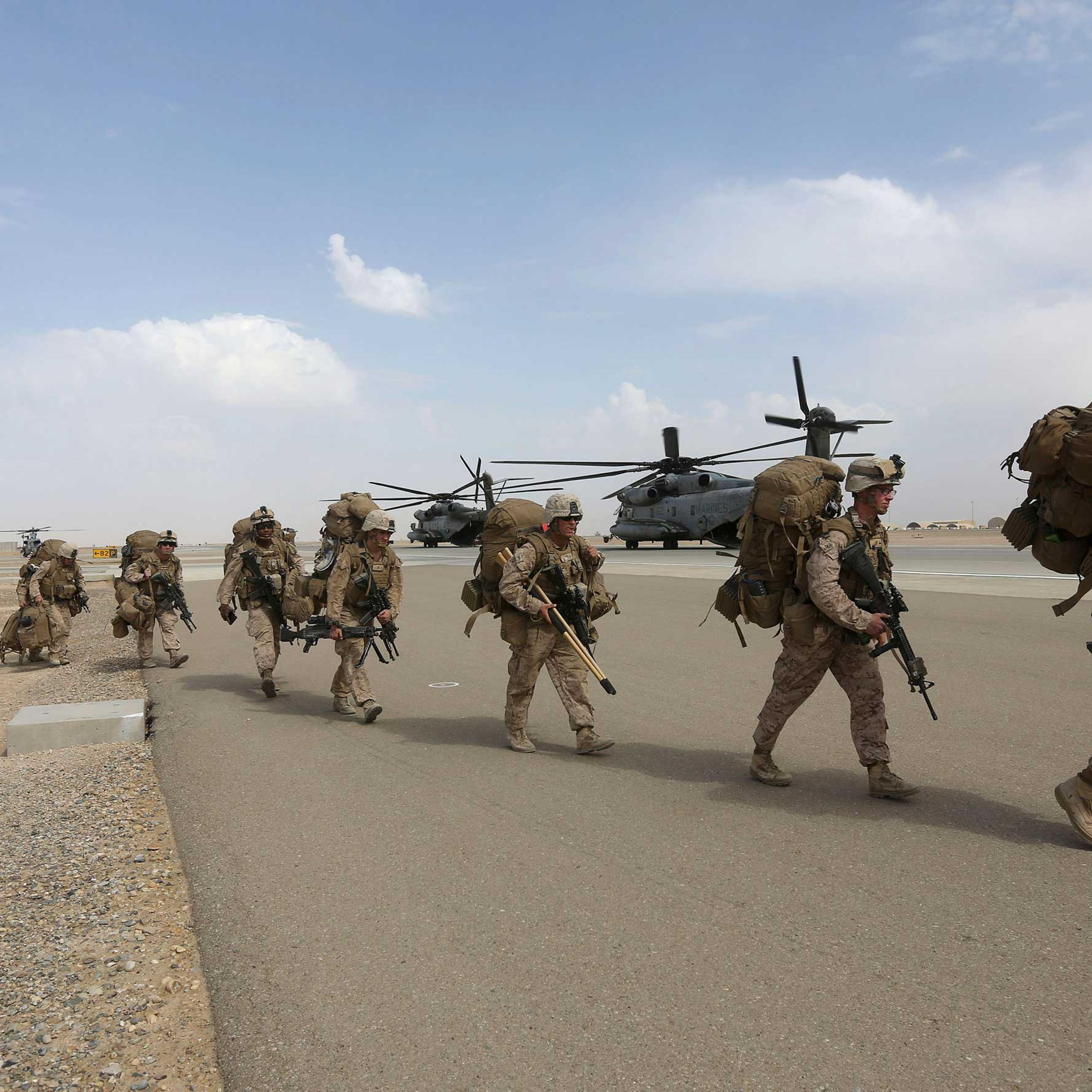 U.S. Marines prepare to depart upon the end of operations for Marines and British combat troops in Helmand