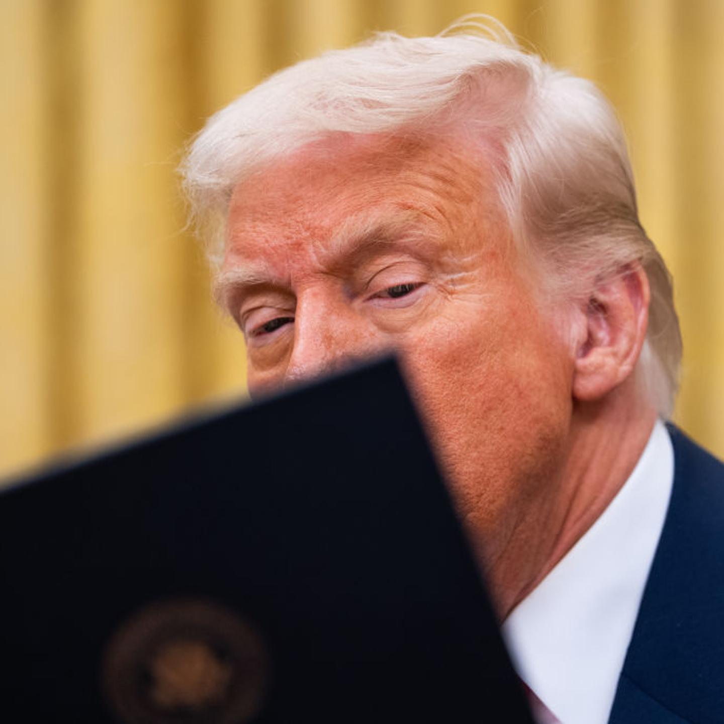 President Trump signs multiple executive orders from the Oval Office of the White House in Washington, D.C, on March 6, 2025.