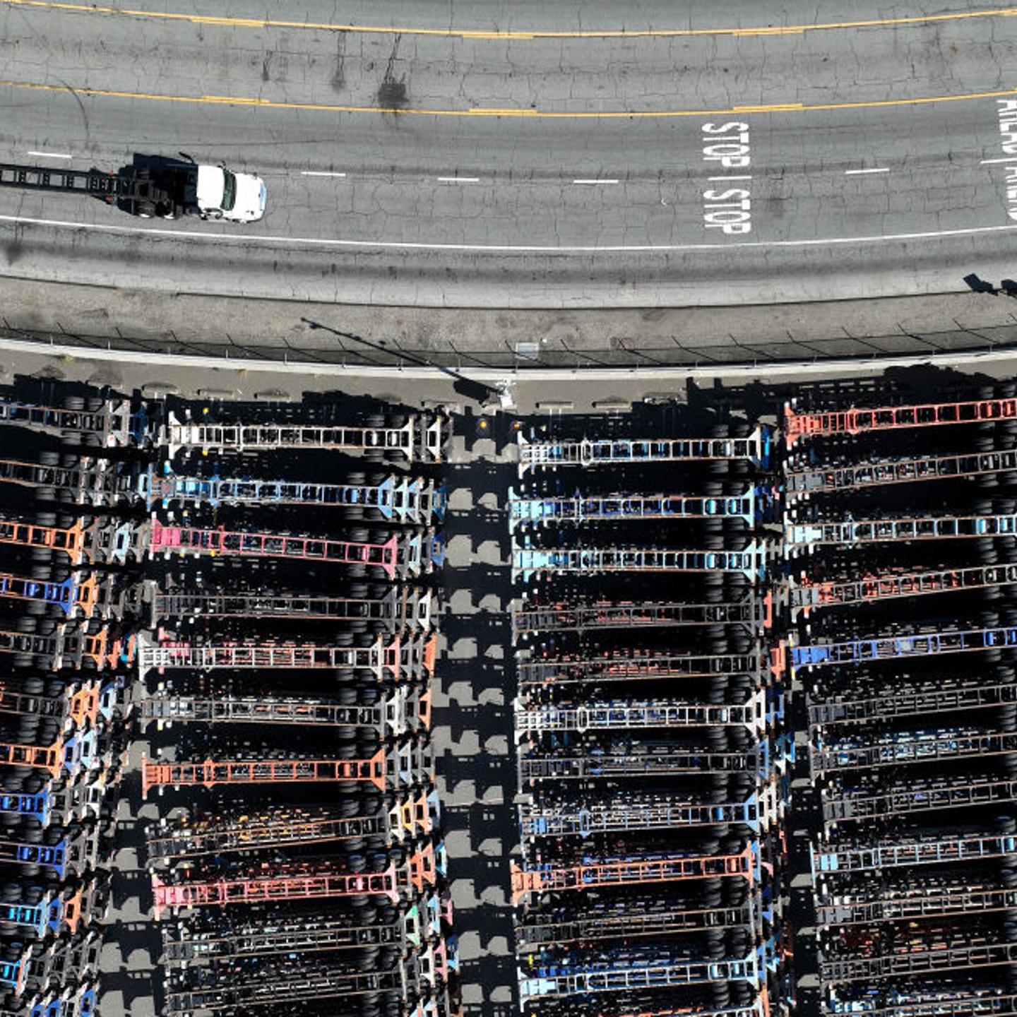 A truck drives by stored truck trailers at the Port of Oakland on March 2, 2023.