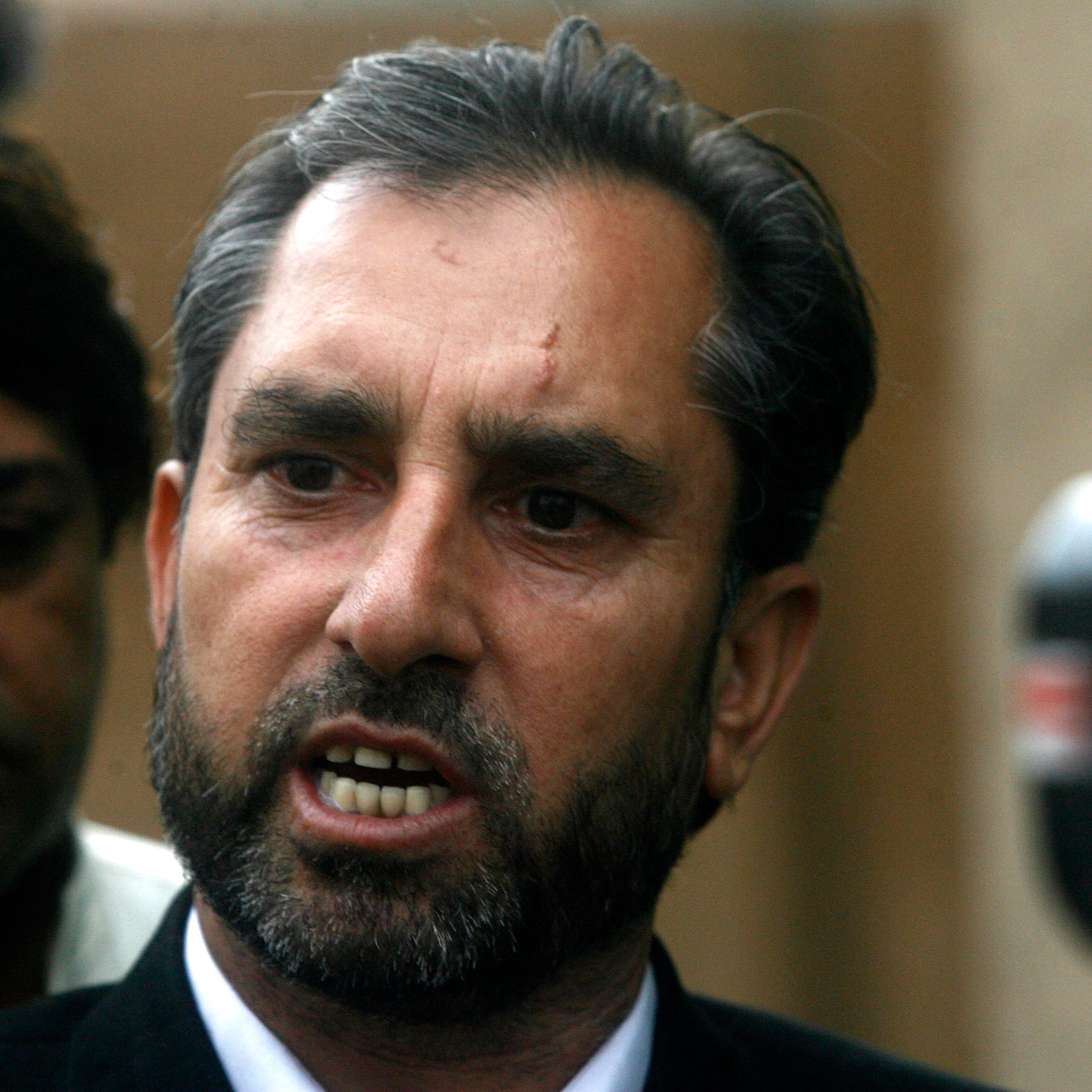 Afridi, lawyer for a Pakistani doctor who helped U.S. officials find al-Qaeda chief Osama bin laden, speaks to the media in Peshawar