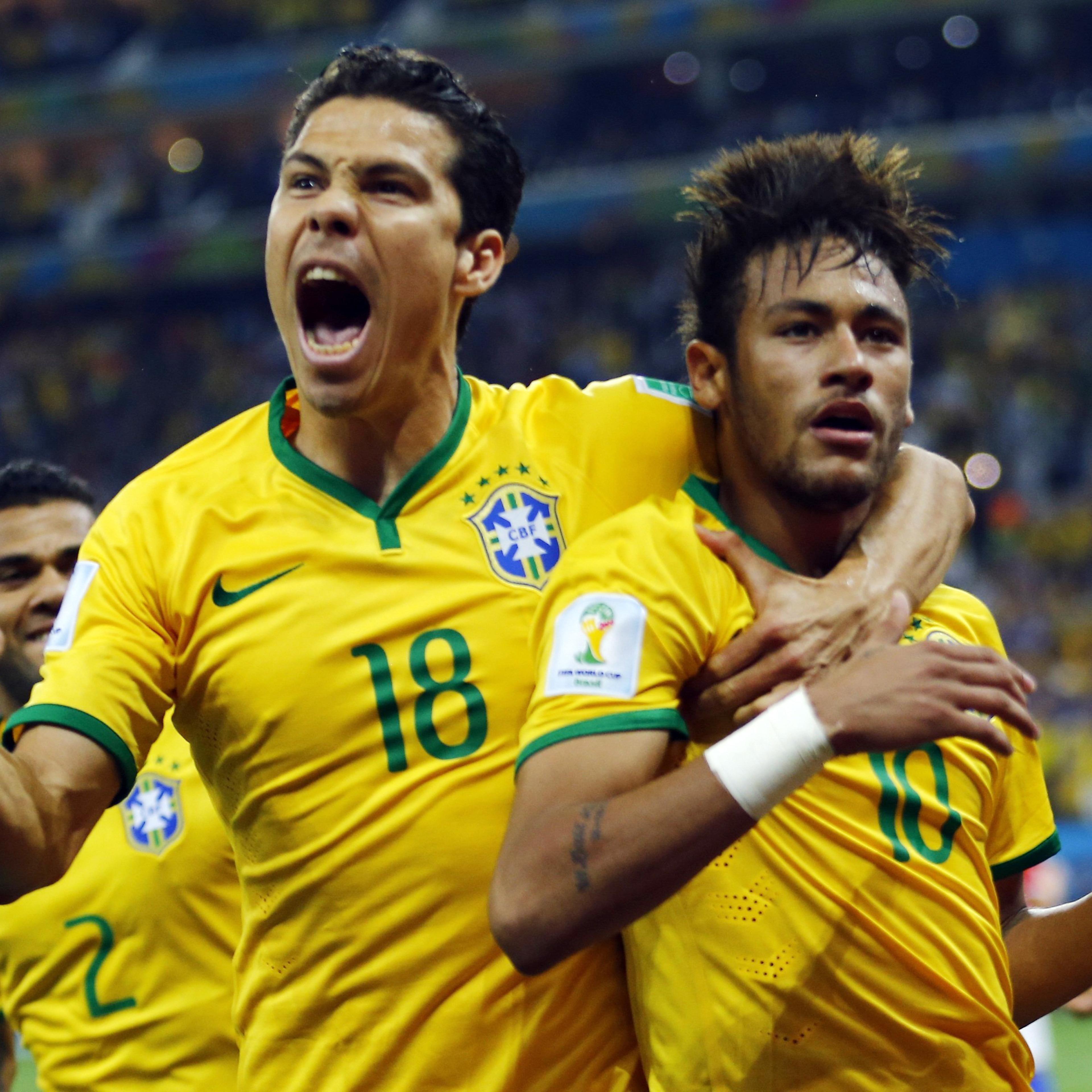 Brazil's Neymar and Hernanes celebrate after Neymar scored a goal from a penalty kick during the 2014 World Cup opening match against Croatia at the Corinthians arena in Sao Paulo