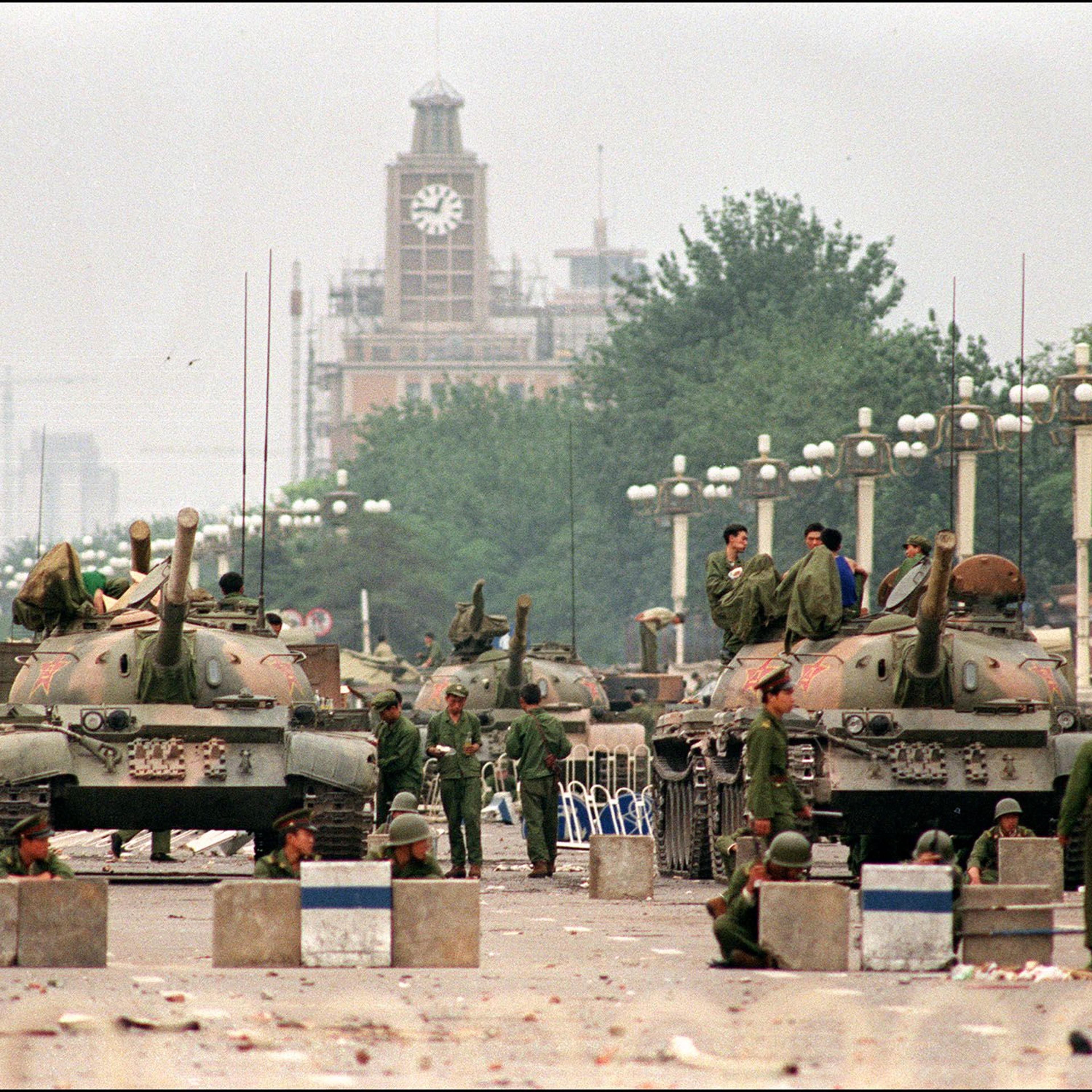 The People's Liberation Army (PLA) tanks guard a