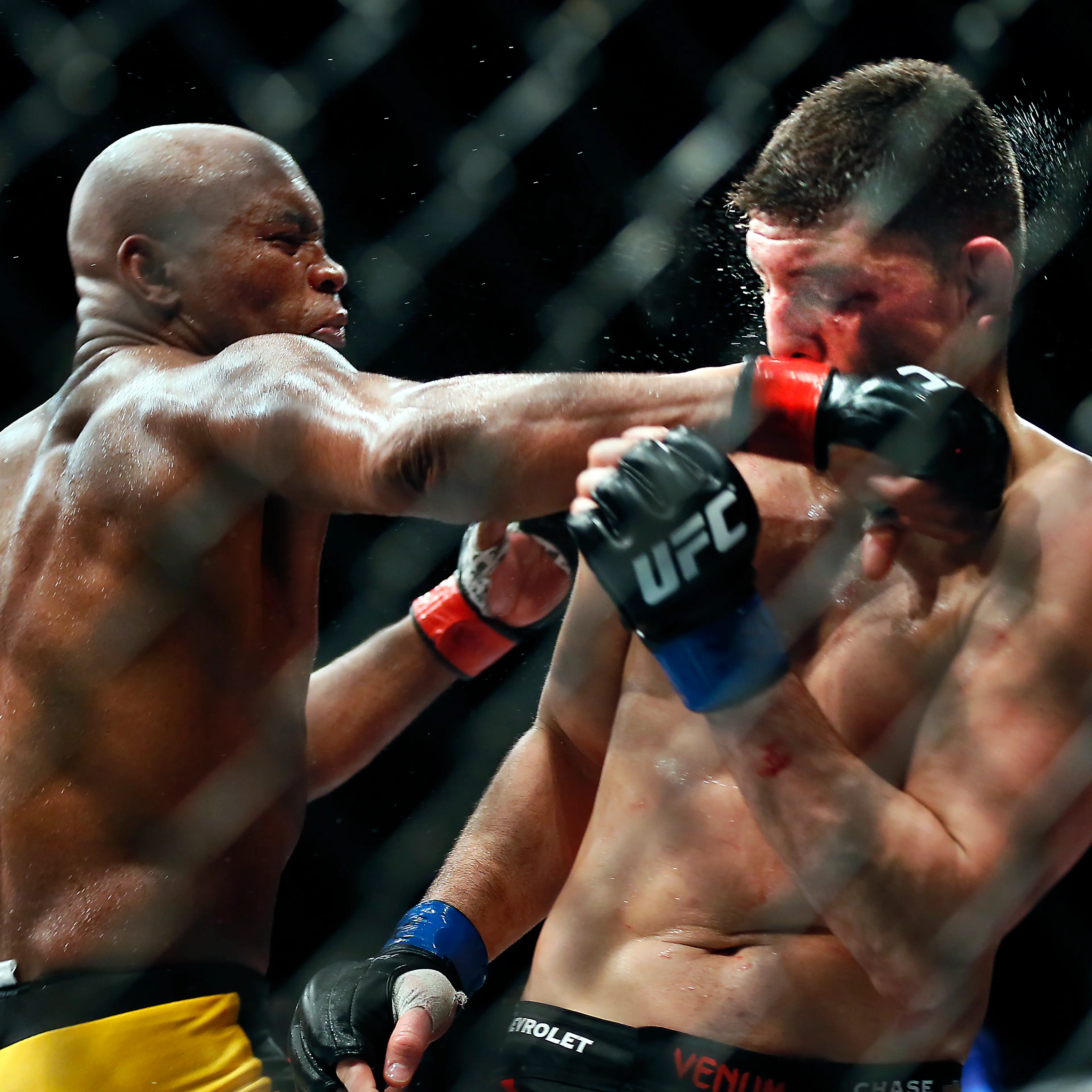 Middleweight Anderson Silva punches Nick Diaz during their fight at the MGM Grand Garden Arena in Las Vegas on Saturday, Jan. 31, 2015