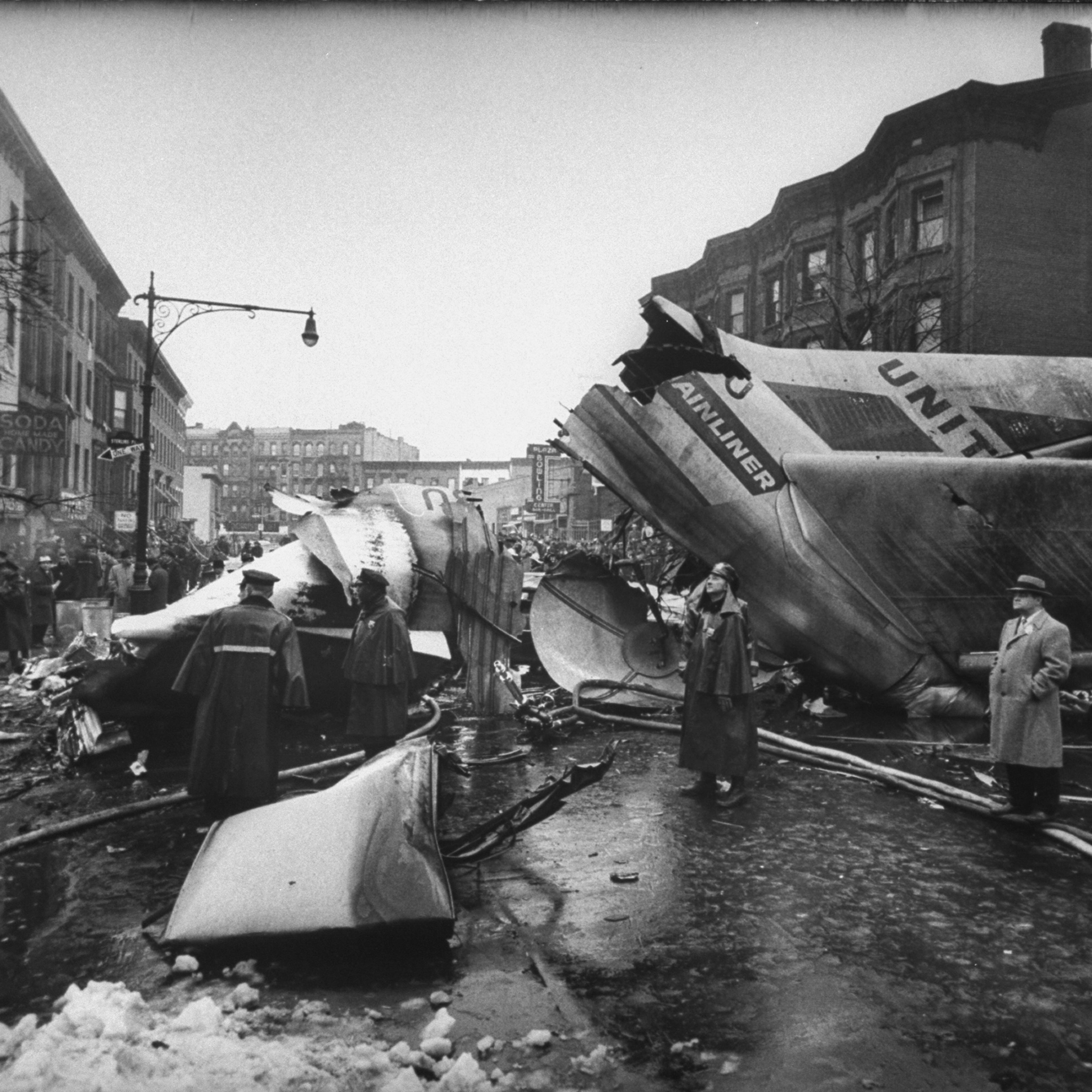 Wreckage litters the streets of Brooklyn after two airliners collide above the borough, December 1960.