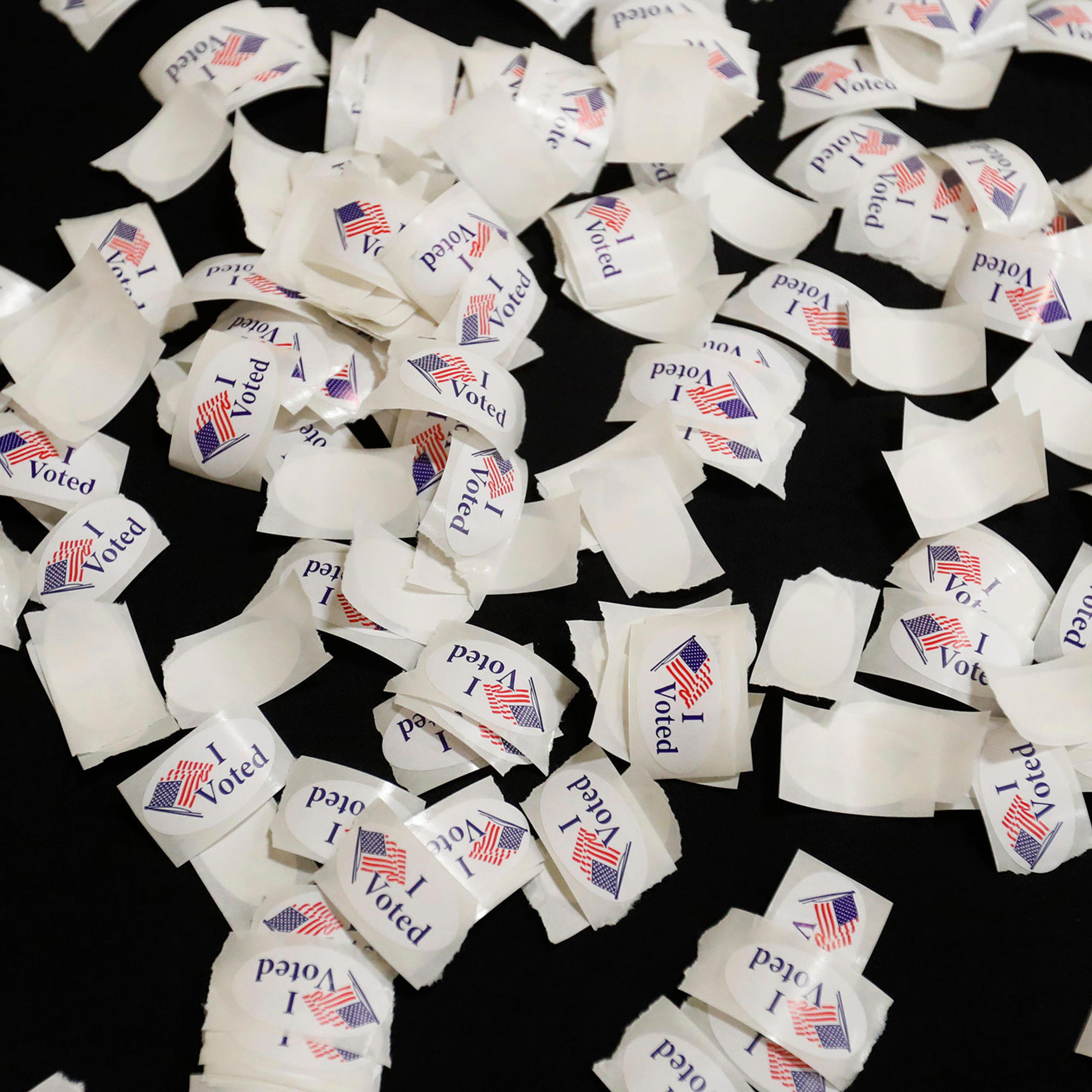 "I voted" stickers are sat in a pile for a voters to pick up after the finish casting their ballots in West Lafayette, Ind. on Oct. 24, 2024.