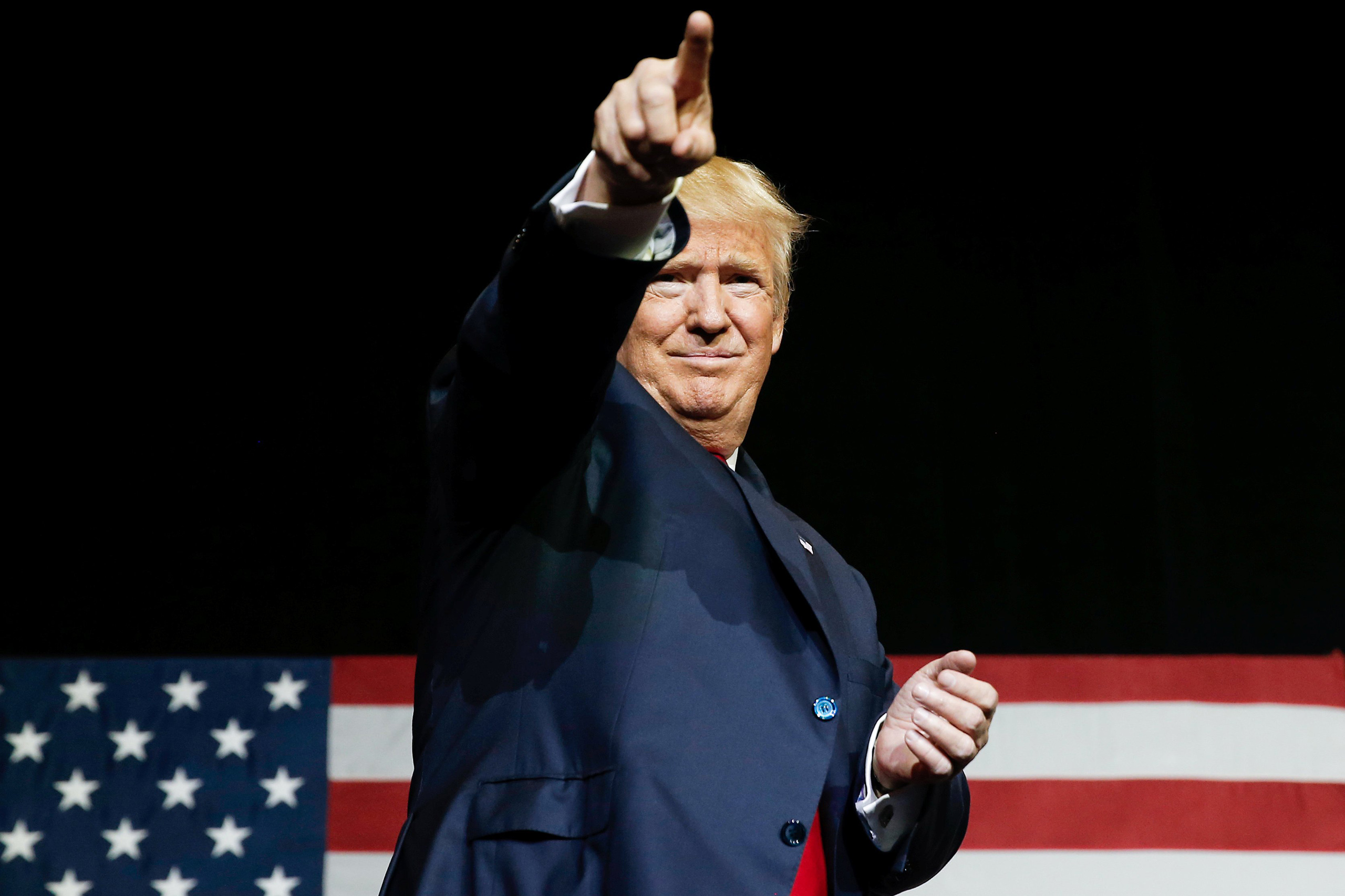 Republican U.S. presidential nominee Donald Trump gestures at a campaign rally in West Palm Beach