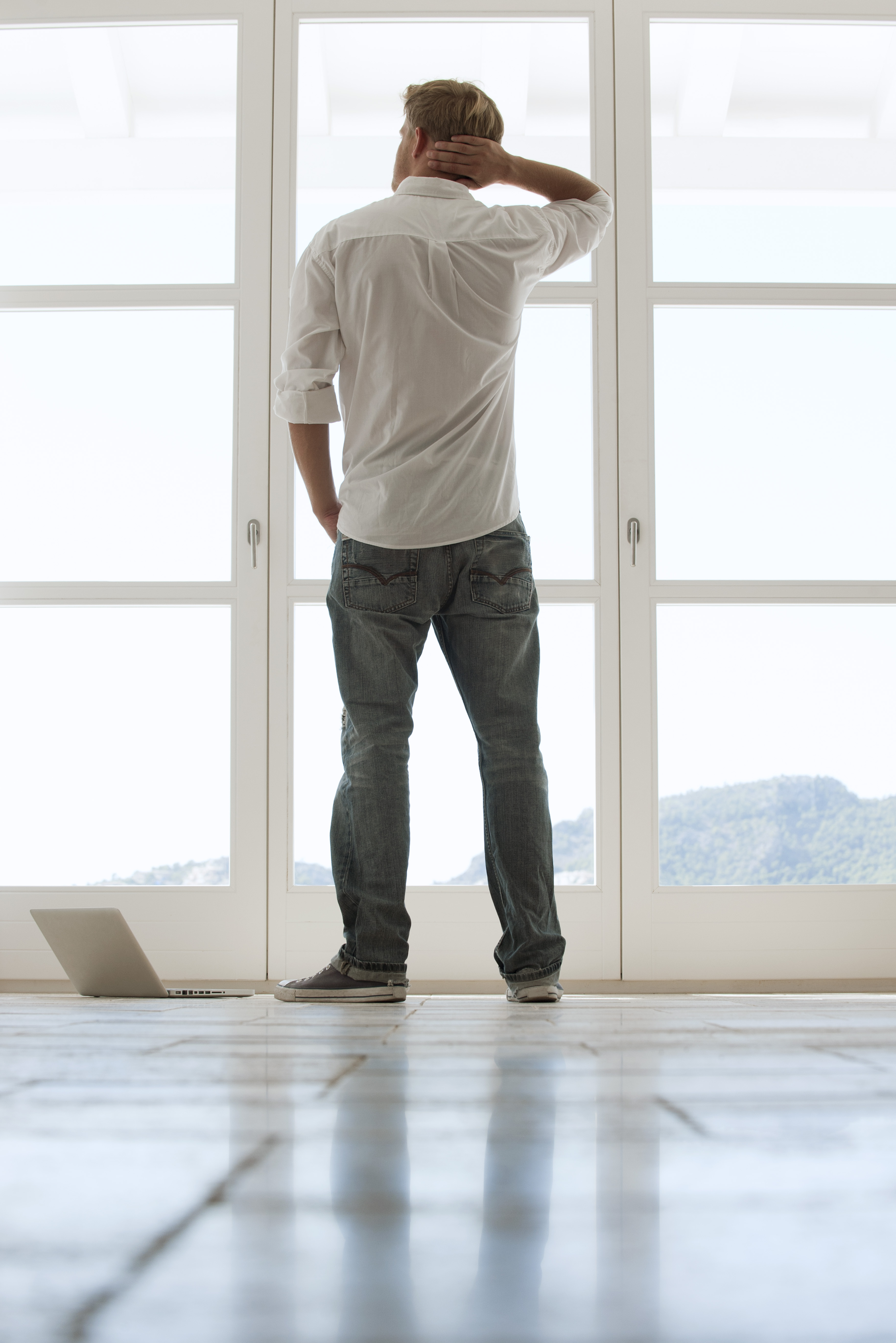 man-looking-out-window