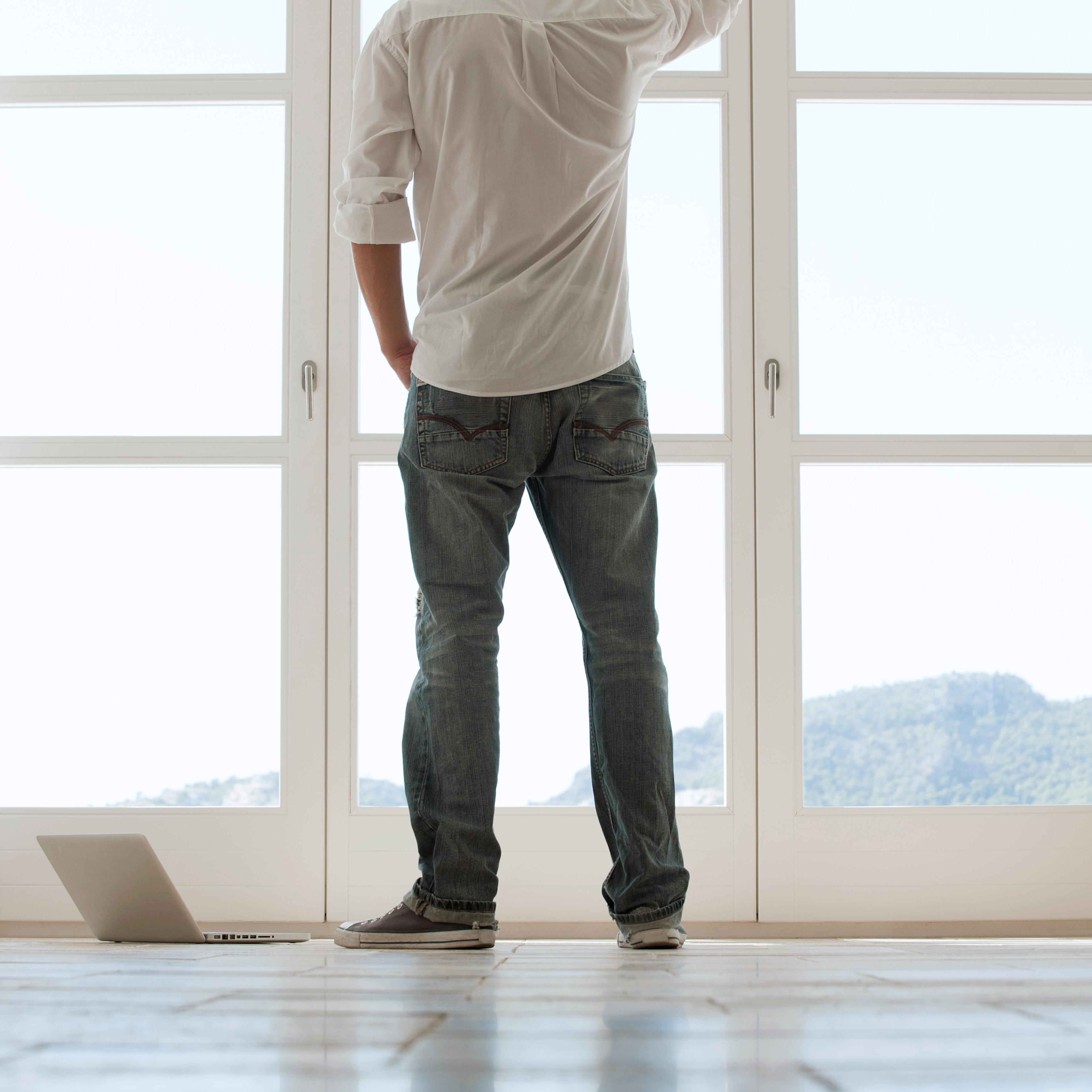 man-looking-out-window